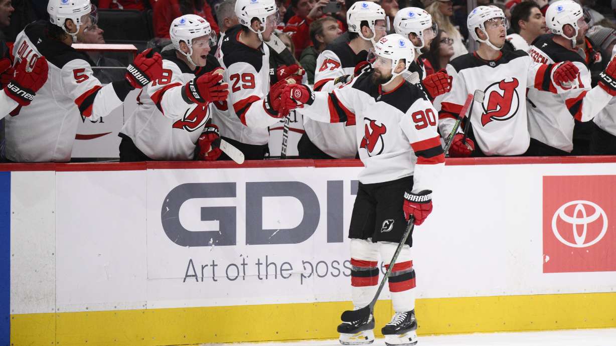 New Jersey Devils left wing Tomas Tatar (90) celebrates his goal during the first period of an NHL hockey game against the Washington Capitals, Saturday, Nov. 23, 2024, in Washington.