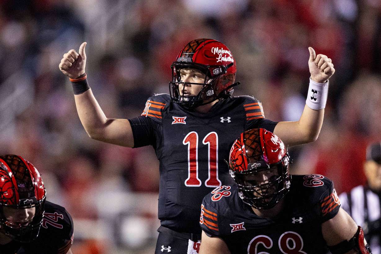Utah Utes quarterback Isaac Wilson (11) gives a thumbs-up before a play during an NCAA football game between the University of Utah Utes and the Iowa State University Cyclones held at Rice-Eccles Stadium in Salt Lake City on Saturday, Nov. 23, 2024.