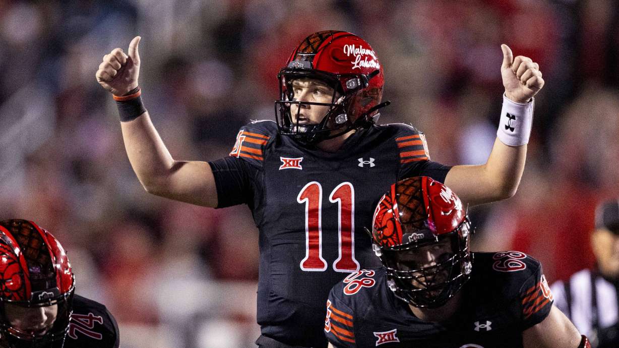 Utah Utes quarterback Isaac Wilson (11) gives a thumbs-up before a play during an NCAA football game between the University of Utah Utes and the Iowa State University Cyclones held at Rice-Eccles Stadium in Salt Lake City on Saturday, Nov. 23, 2024.
