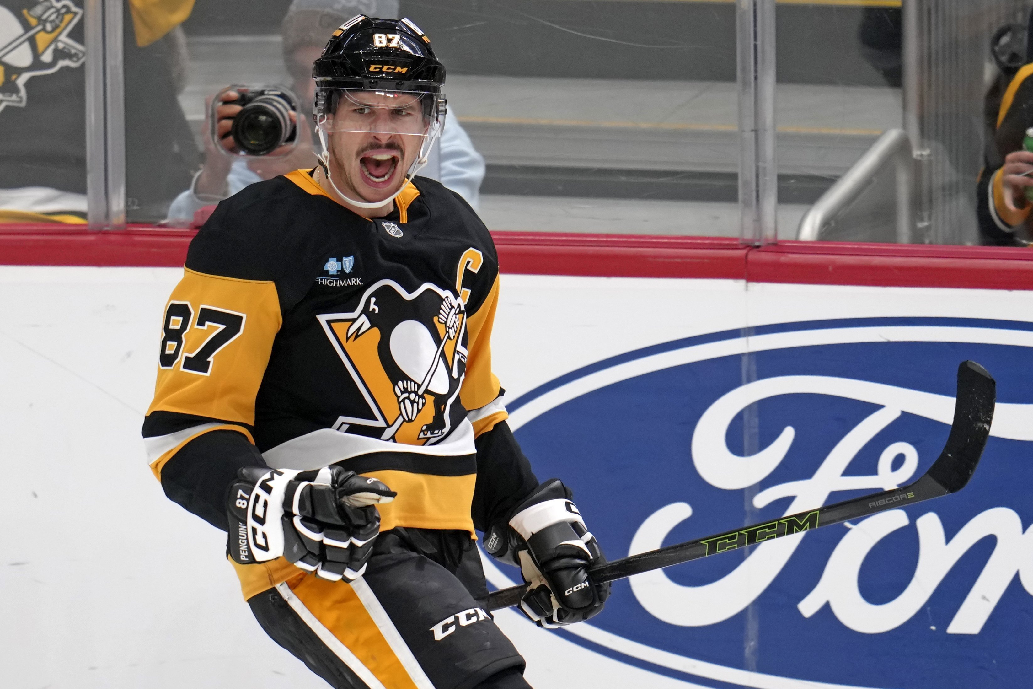 Pittsburgh Penguins' Sidney Crosby (87) celebrates after getting his 600th career goal in the NHL during the second period of an NHL hockey game against the Utah Hockey Club, Saturday, Nov. 23, 2024, in Pittsburgh.