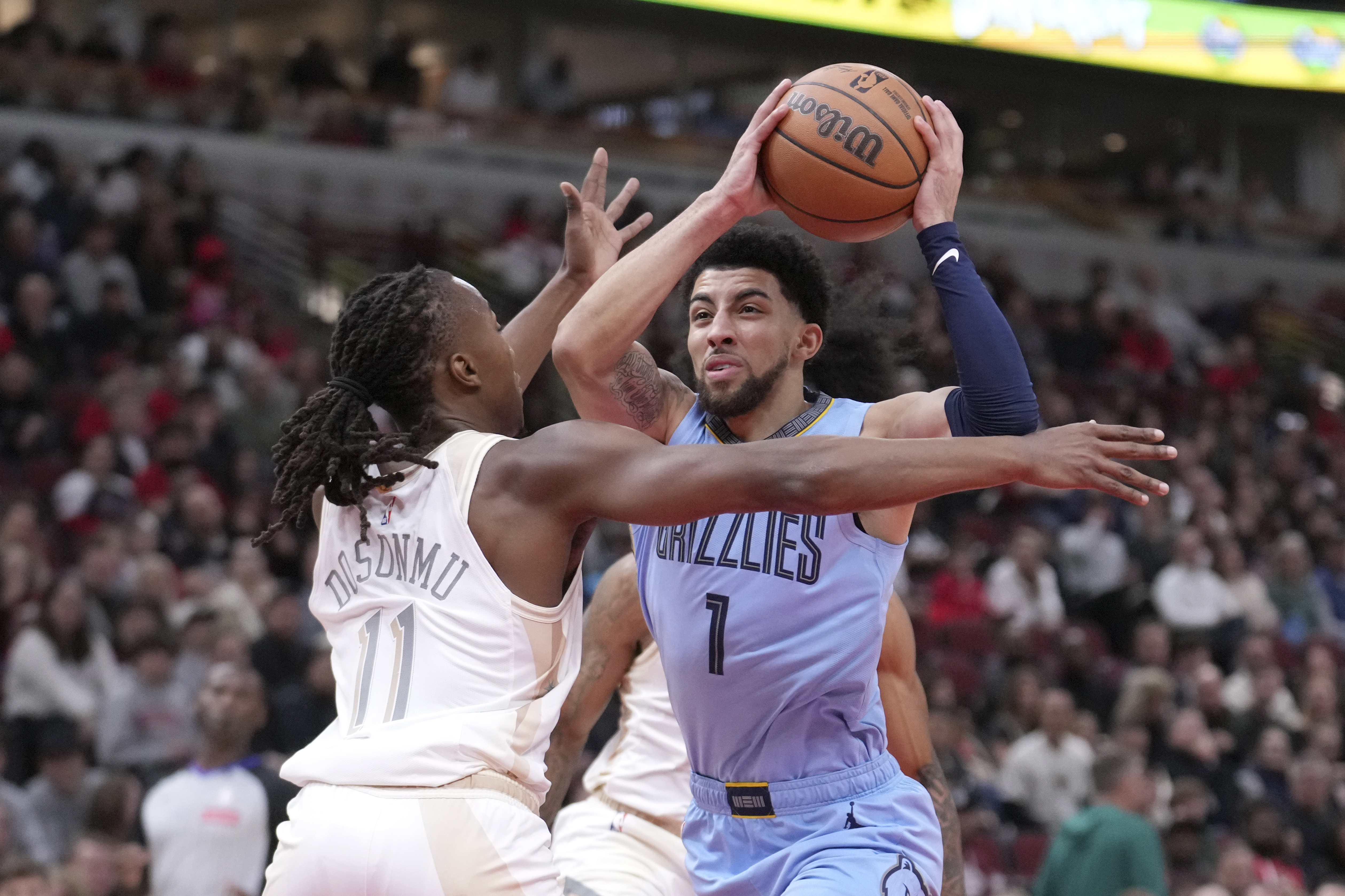 Memphis Grizzlies' Scotty Pippen Jr. drives to the basket as Chicago Bulls' Ayo Dosunmu defends during the first half of an NBA basketball game Saturday, Nov. 23, 2024, in Chicago. 