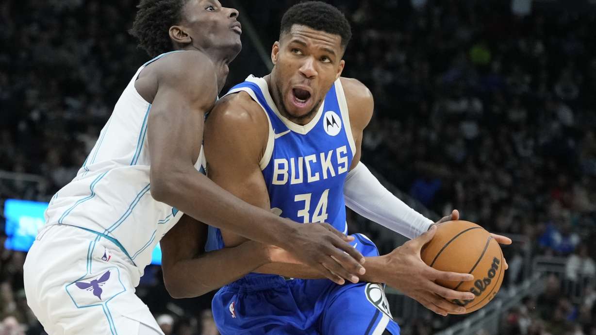 Charlotte Hornets' Moussa Diabate fouls Milwaukee Bucks' Giannis Antetokounmpo during the second half of an NBA basketball game Saturday, Nov. 23, 2024, in Milwaukee. The Bucks won 125-119.