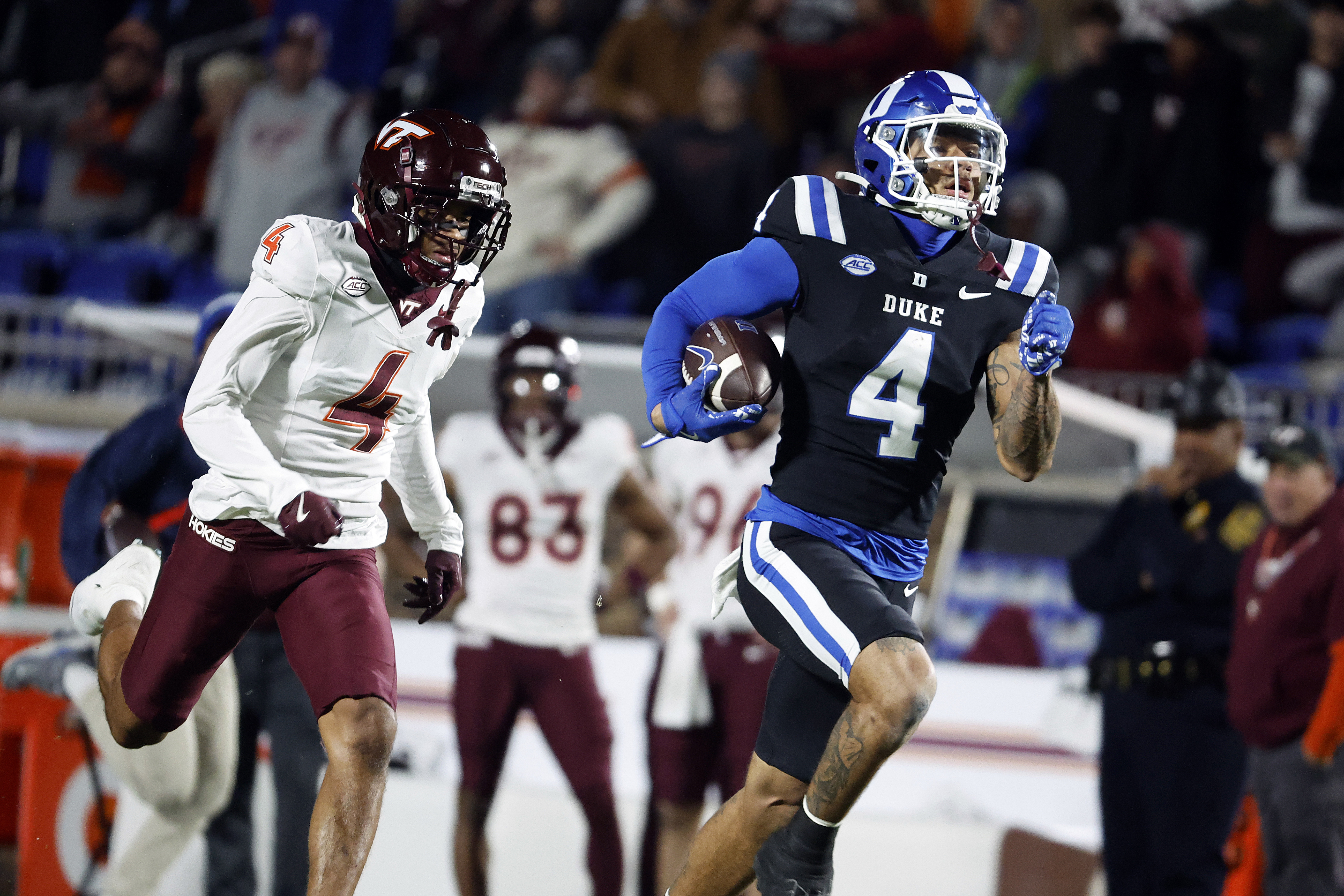 Duke's Eli Pancol, right, runs away from Virginia Tech's Mansoor Delane, left, on his way to a touchdown during the first half of an NCAA college football game in Durham, N.C., Saturday, Nov. 23, 2024.