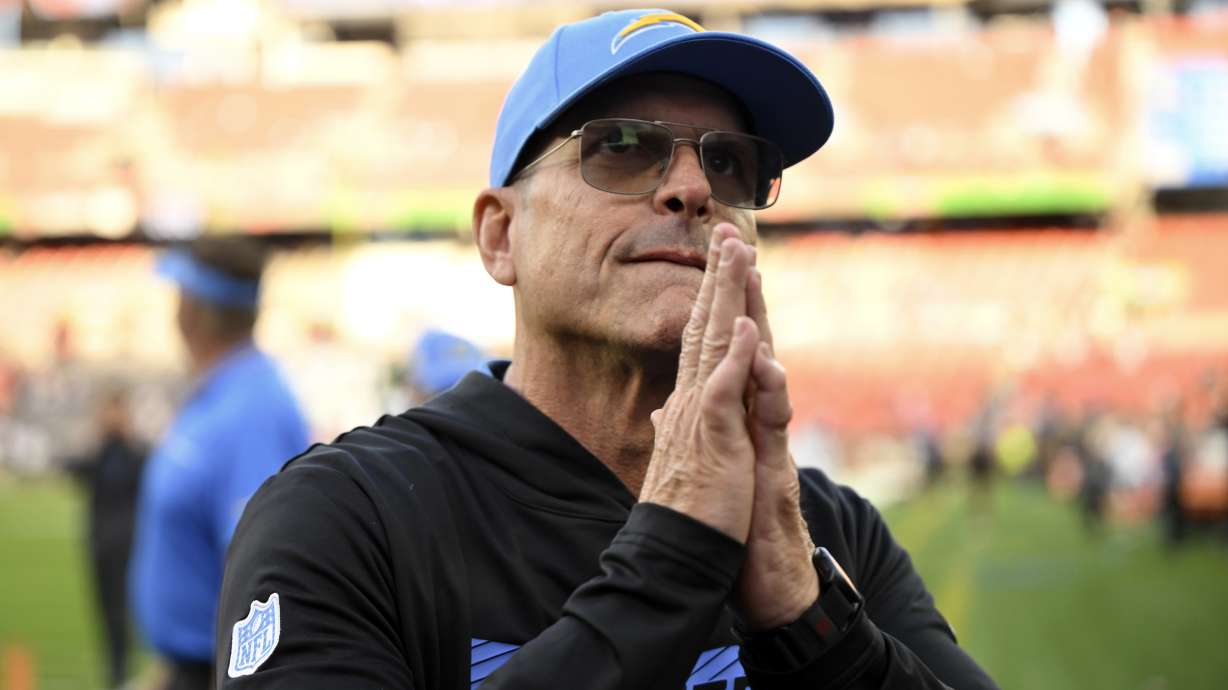 Los Angeles Chargers head coach Jim Harbaugh leaves the field after the Chargers beat the Cleveland Browns 27-10 in an NFL football game Sunday, Nov. 3, 2024, in Cleveland.