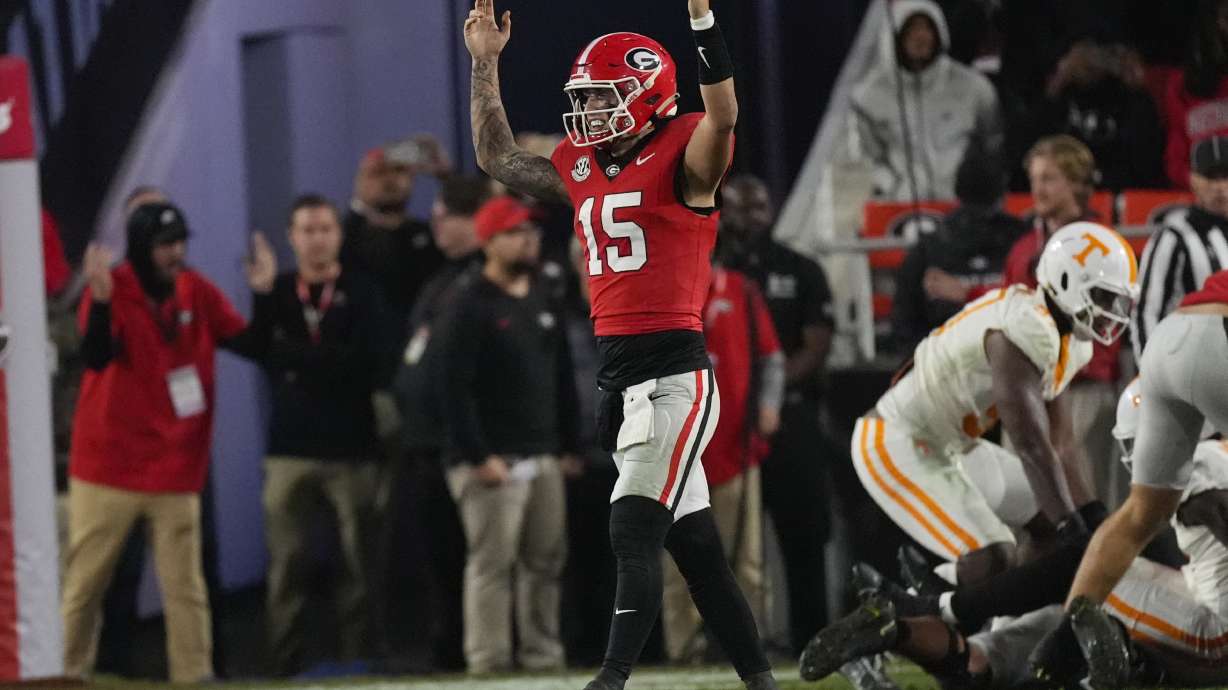 Georgia quarterback Carson Beck (15) reacts after a Georgia touchdown during the second half of an NCAA college football game against Tennessee, Saturday, Nov. 16, 2024, in Athens, Ga.