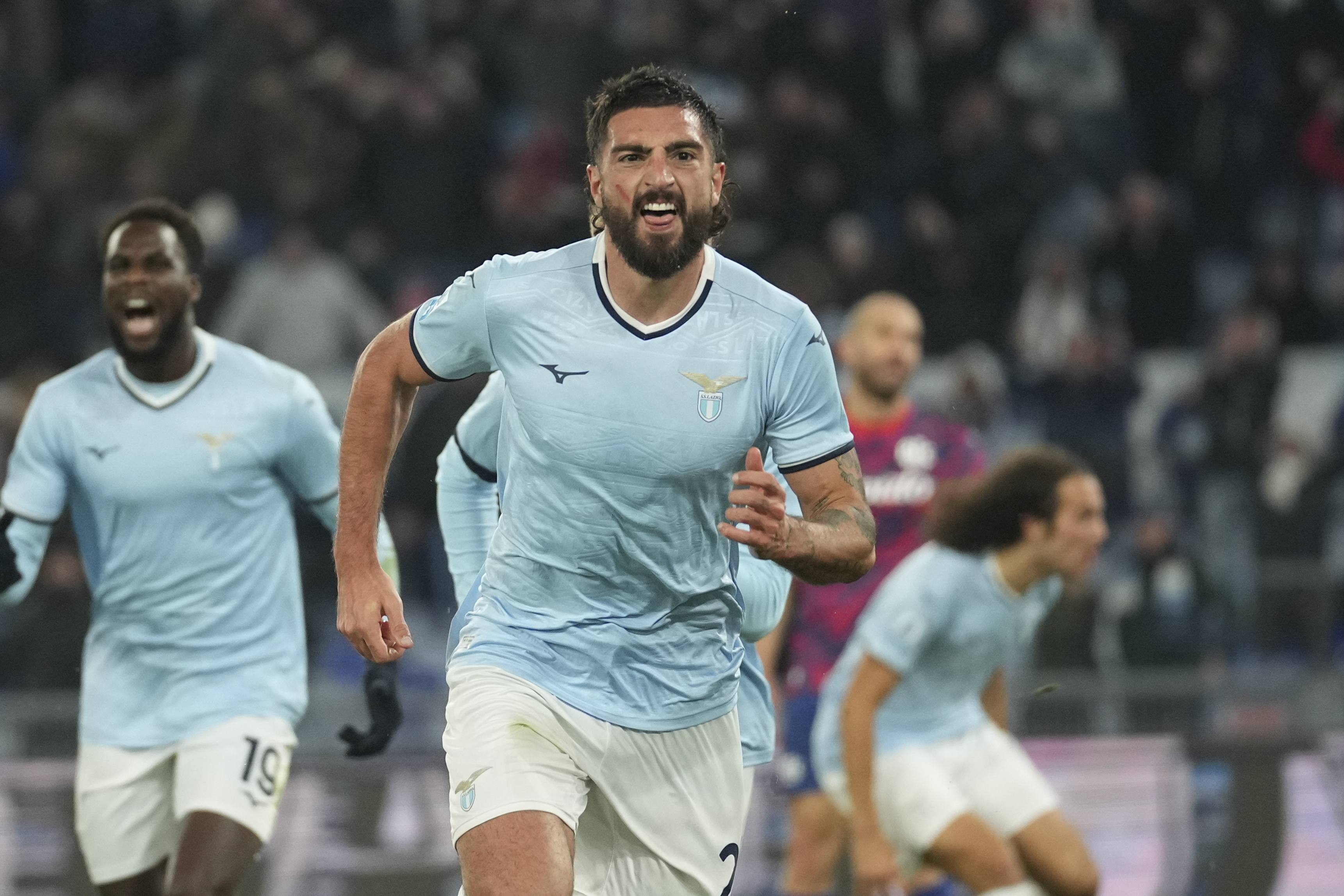 Lazio's Samuel Grigot, centre, celebrates after scoring his side's opening goal during a Serie A soccer match between Lazio and Bologna, at Rome's Olympic Stadium, Sunday, Nov. 24, 2024. 
