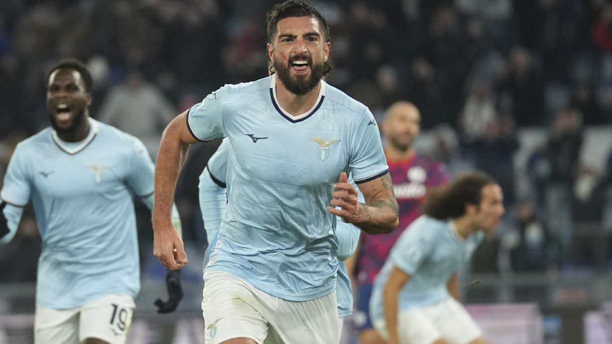Lazio's Samuel Grigot, centre, celebrates after scoring his side's opening goal during a Serie A soccer match between Lazio and Bologna, at Rome's Olympic Stadium, Sunday, Nov. 24, 2024.