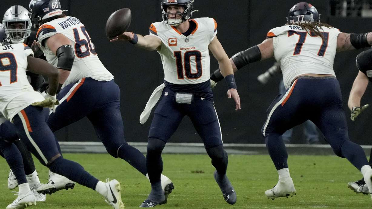 Denver Broncos quarterback Bo Nix (10) throws the ball against the Las Vegas Raiders during the second half of an NFL football game, Sunday, Nov. 24, 2024, in Las Vegas.