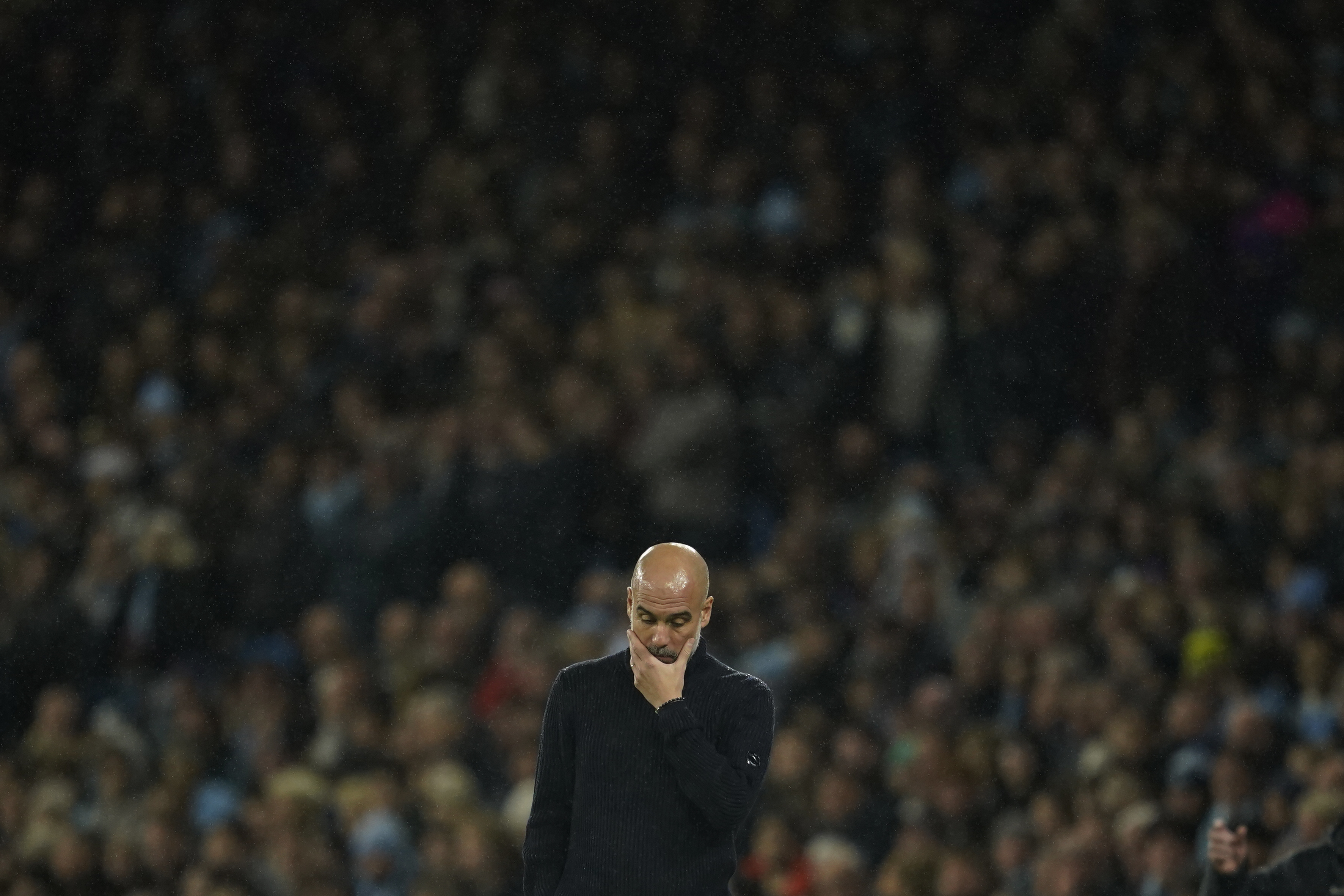 Manchester City's head coach Pep Guardiola reacts during the English Premier League soccer match between Manchester City and Tottenham at the Etihad Stadium in Manchester, England, Sunday, Nov. 24, 2024. 