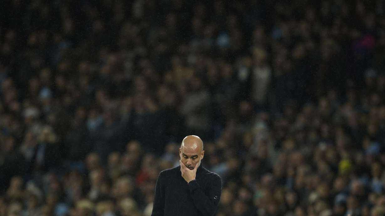 Manchester City's head coach Pep Guardiola reacts during the English Premier League soccer match between Manchester City and Tottenham at the Etihad Stadium in Manchester, England, Sunday, Nov. 24, 2024.