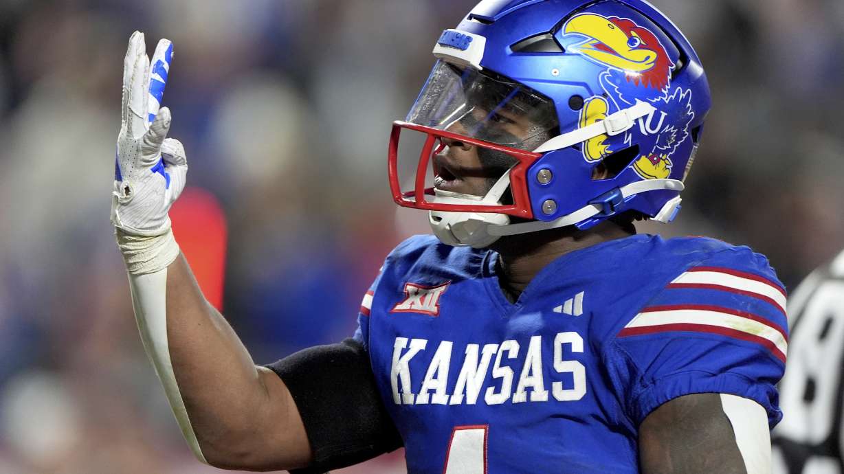 Kansas running back Devin Neal celebrates after making a touchdown during the second half of an NCAA college football game against Colorado, Saturday, Nov. 23, 2024, in Kansas City, Mo.