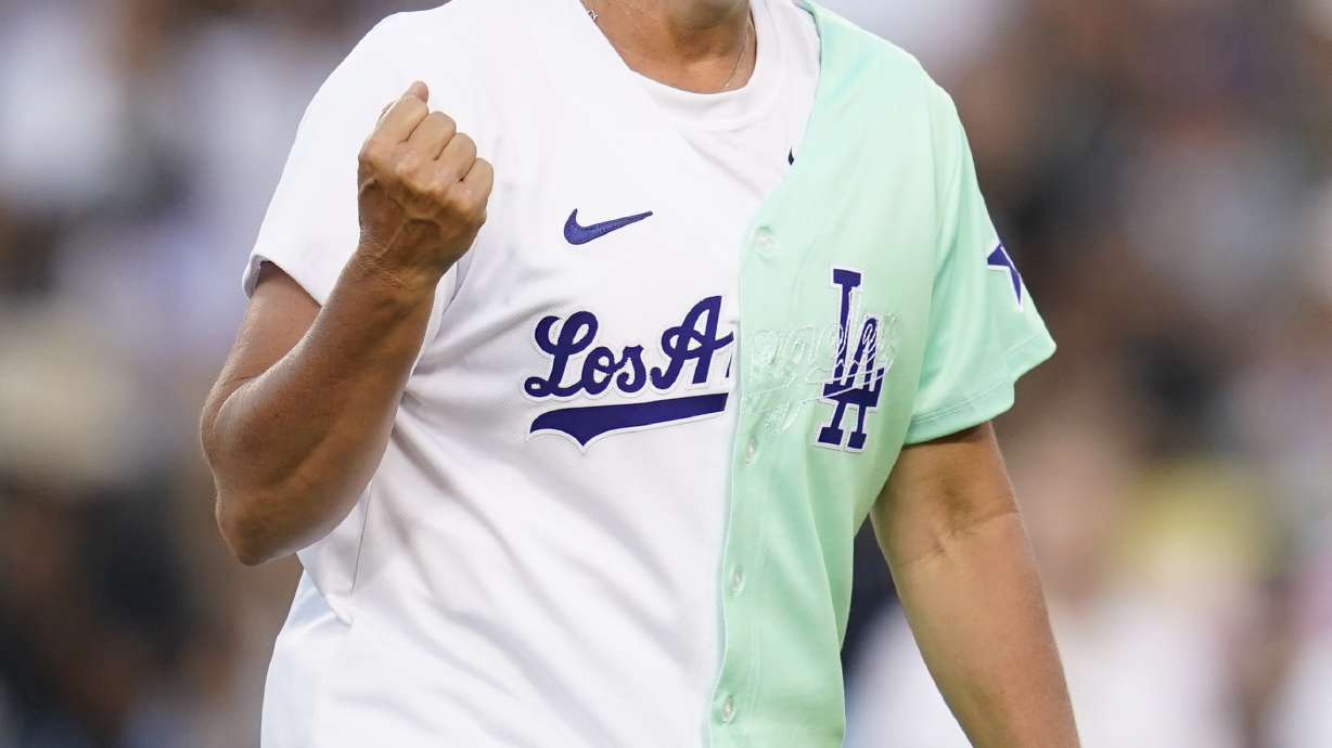 FILE - Former professional softball player Lisa Fernandez smiles on the field during the MLB All Star Celebrity Softball game, Saturday, July 16, 2022, in Los Angeles.