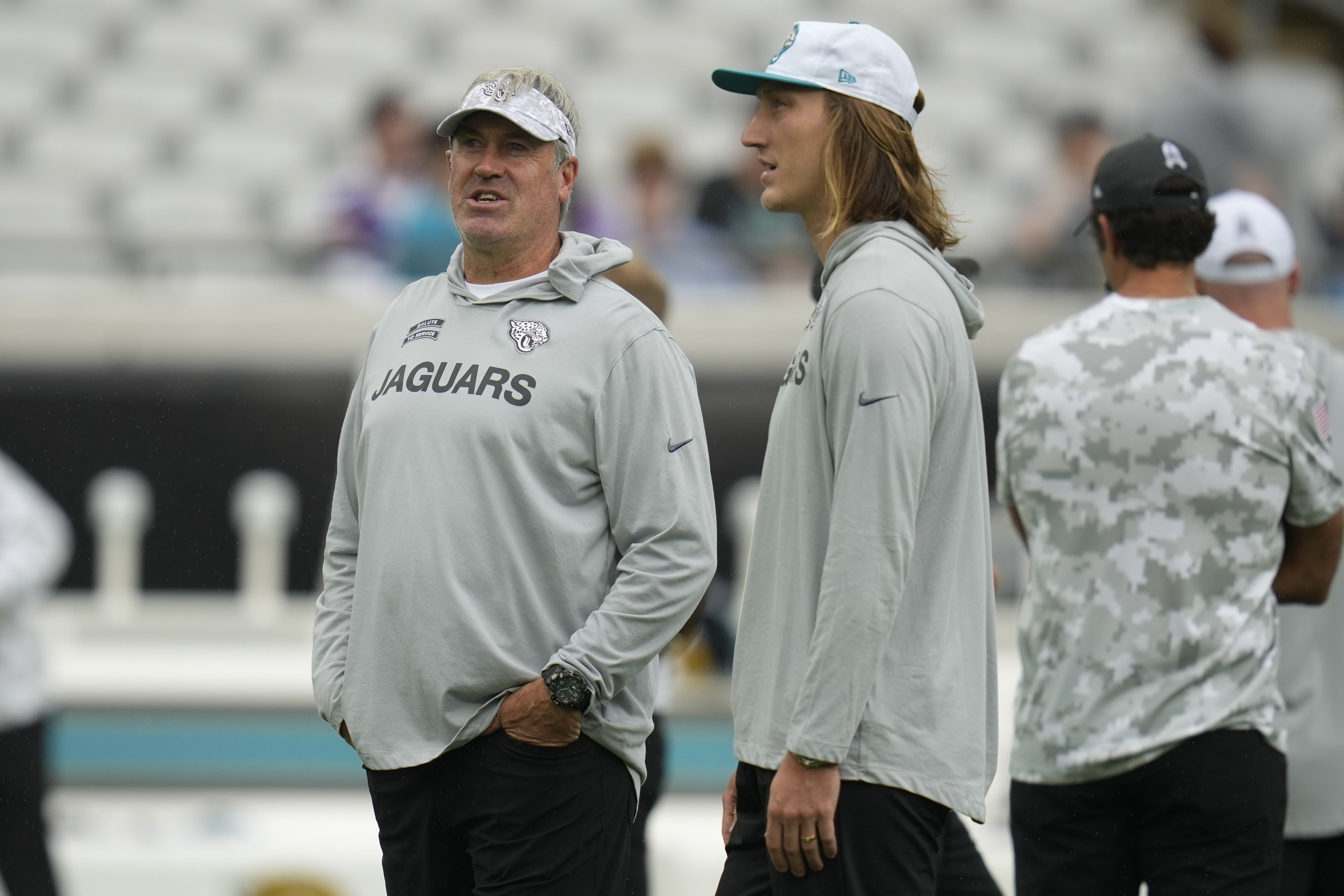 Jacksonville Jaguars head coach Doug Pederson, left, and quarterback Trevor Lawrence stand on the field before an NFL football game against the Minnesota Vikings, Sunday, Nov. 10, 2024, in Jacksonville, Fla.