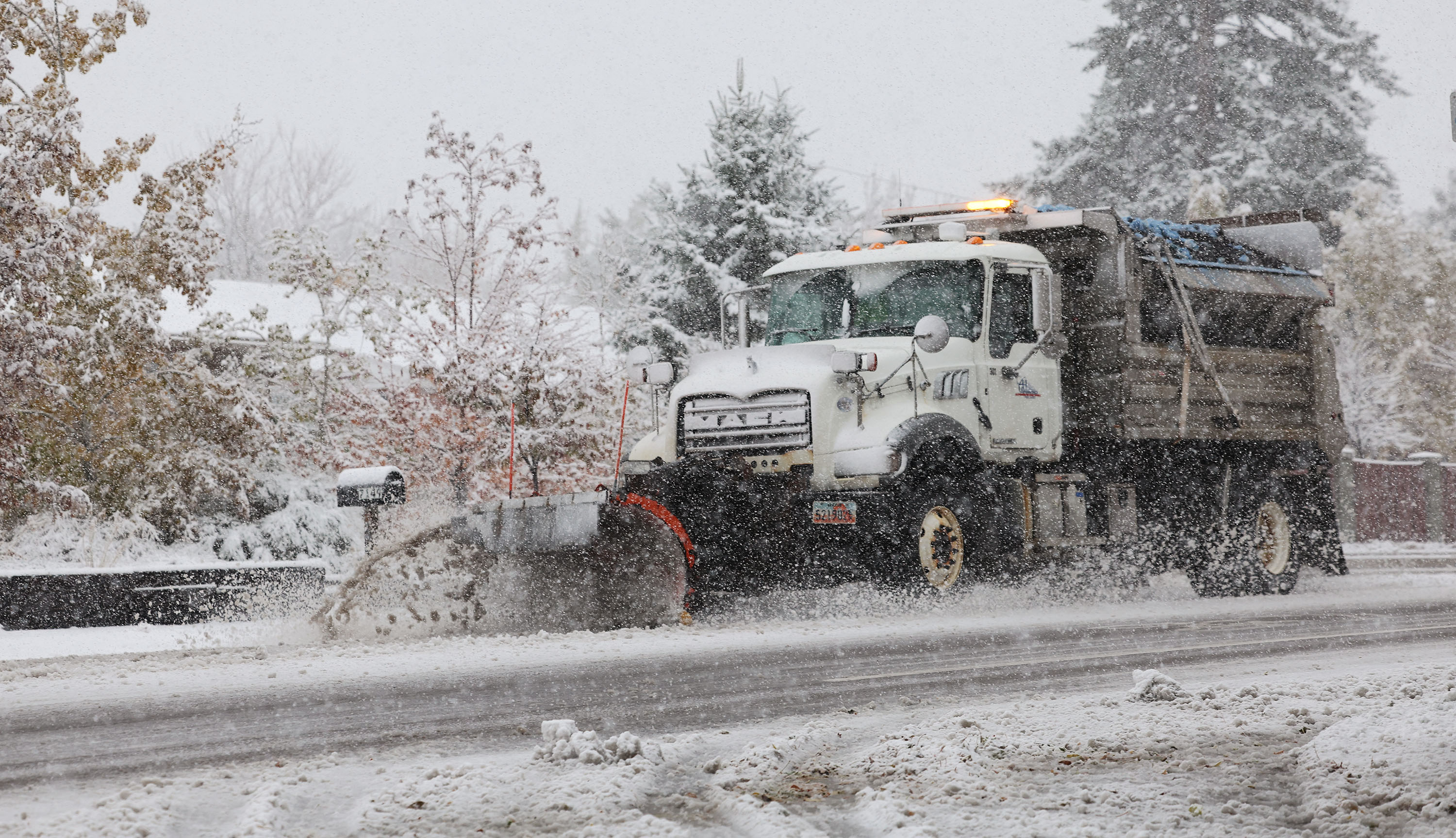 A snow plow clears the road during the snow storm in Cottonwood Heights on Nov. 12. A winter storm arriving in Utah on Monday could deliver 1 to 3 feet of snow in the mountains by Wednesday and some snow in Utah's valley communities.