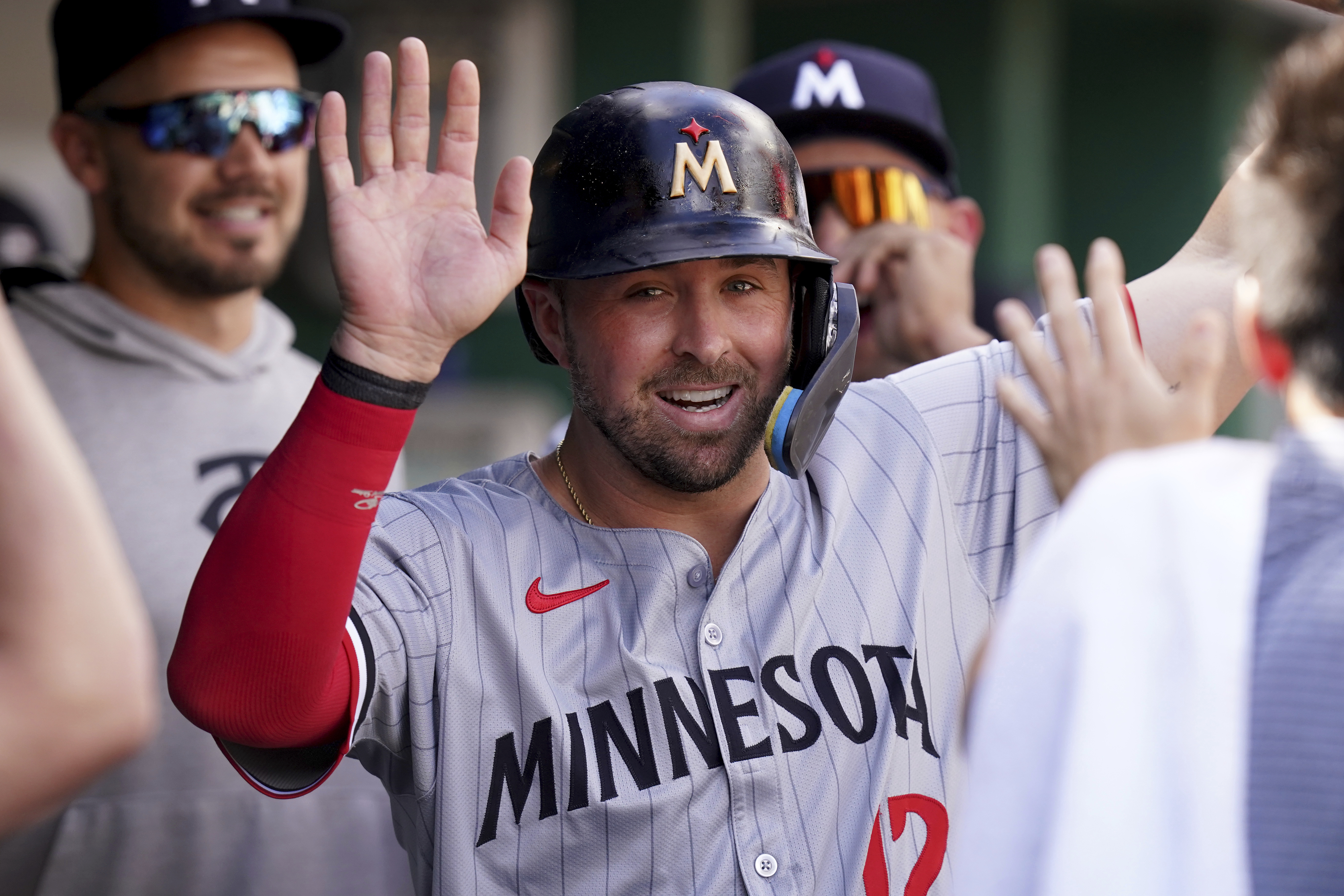 FILE - Minnesota Twins' Kyle Farmer celebrates in the dugout after scoring during the 10th inning of a baseball game against the Pittsburgh Pirates Sunday, June 9, 2024, in Pittsburgh.