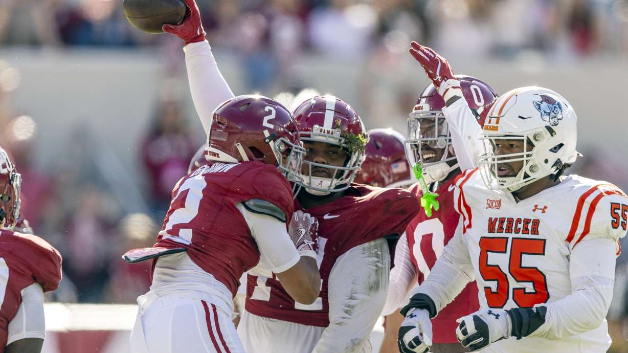 Alabama defensive lineman Damon Payne Jr. (44) celebrates his fumble recovery with defensive back Zabien Brown (2) and linebacker Deontae Lawson (0), during the first half of an NCAA college football game against Mercer, Saturday, Nov. 16, 2024, in Tuscaloosa, Ala.
