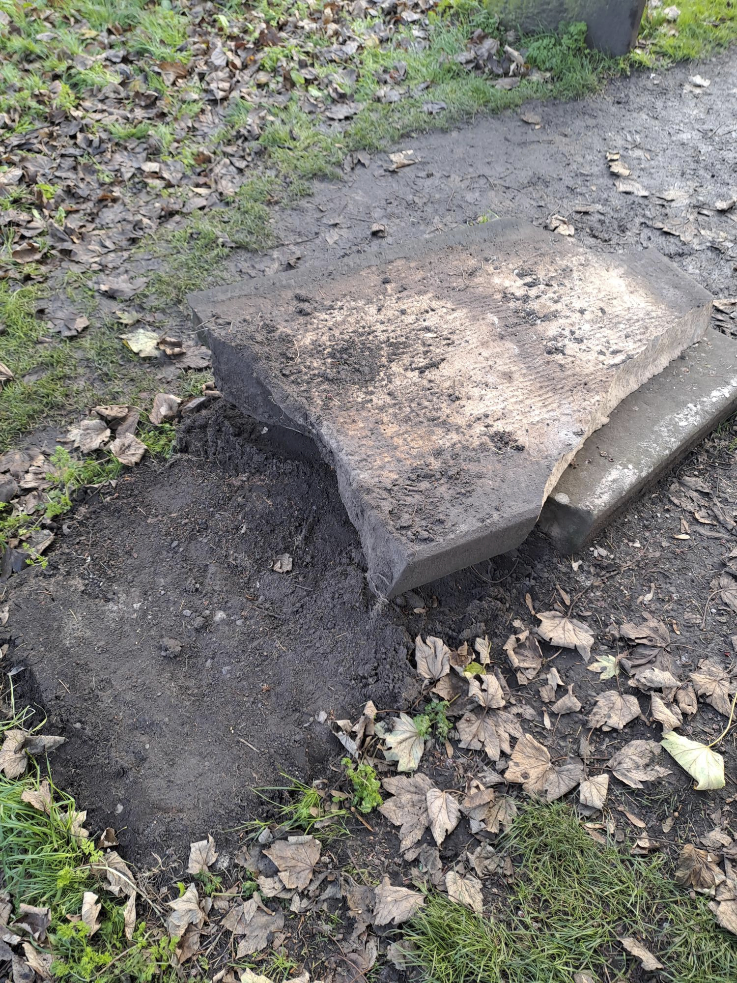 In this picture, provided by the West Mercia Police on Monday, a smashed movie prop tombstone that was used for the "A Christmas Carol" movie is seen in Shrewsbury, England.