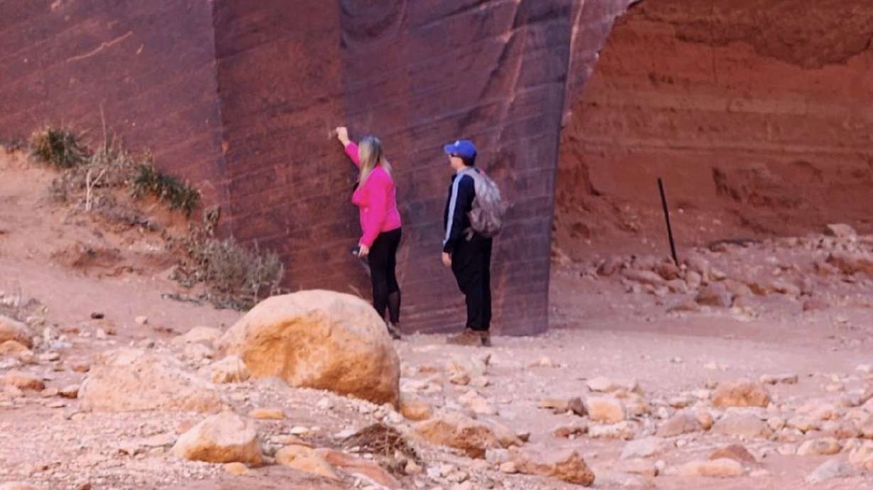 Two people the Kane County Sheriff's Office was looking to contact in a land vandalism case on Nov. 23. Bureau of Land Management officials said a woman was arrested in the case over the weekend.