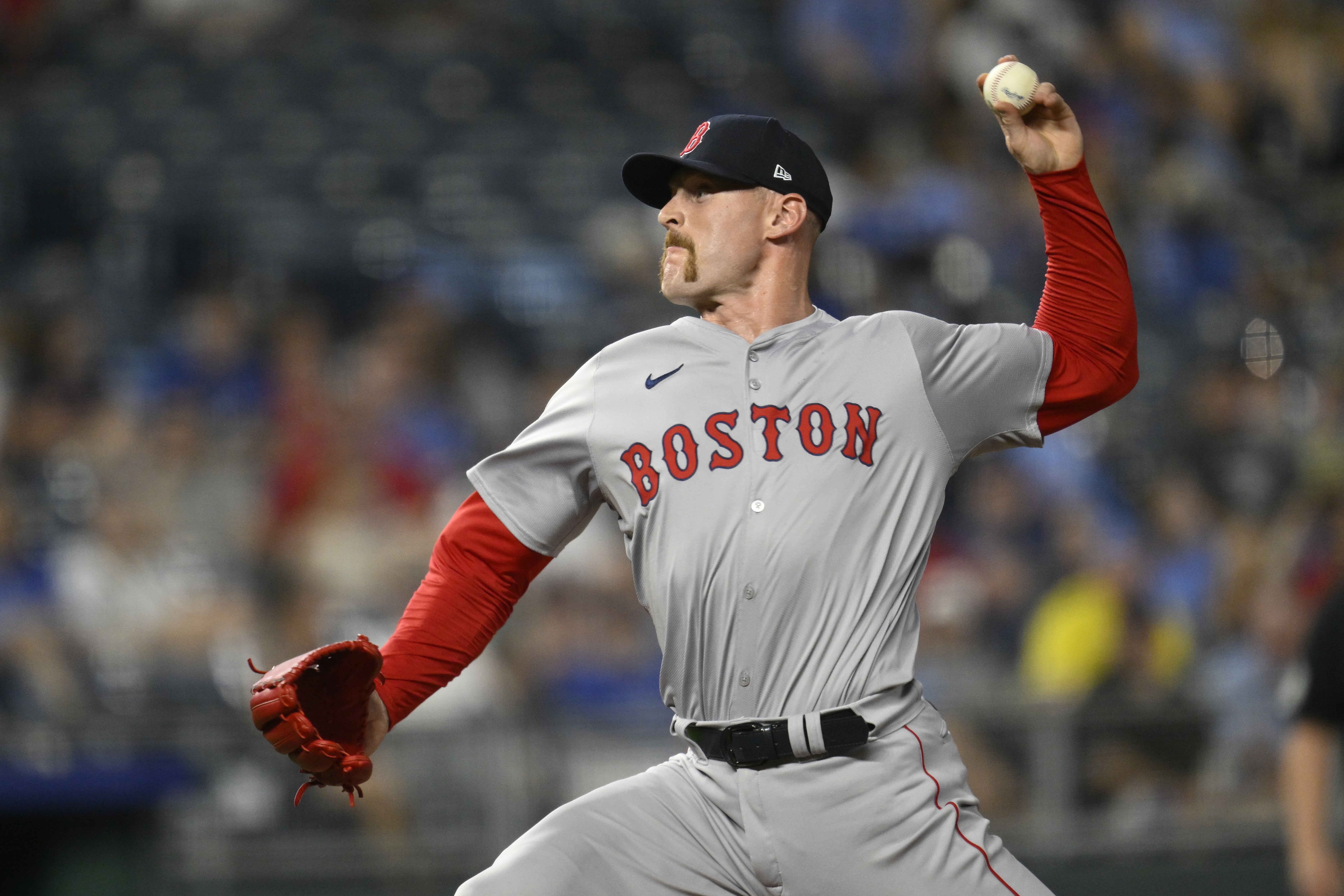 FILE - Boston Red Sox relief pitcher Cam Booser throws to a Kansas City Royals batter during the ninth inning of a baseball game against the Kansas City Royals, Monday, Aug. 5, 2024, in Kansas City, Mo.