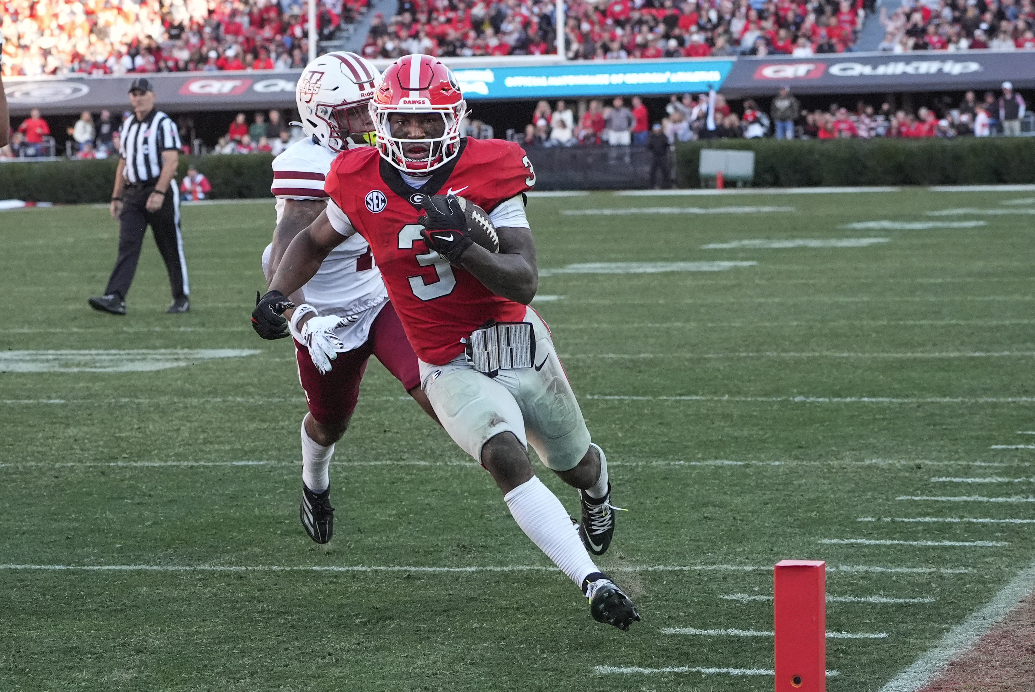Georgia running back Nate Frazier (3) out runs UMass defensive back Leonard St. Gourdin (11) to the end zone for a tochdown during the second half of an NCAA college football game, Saturday, Nov. 23, 2024, in Athens, Ga. 