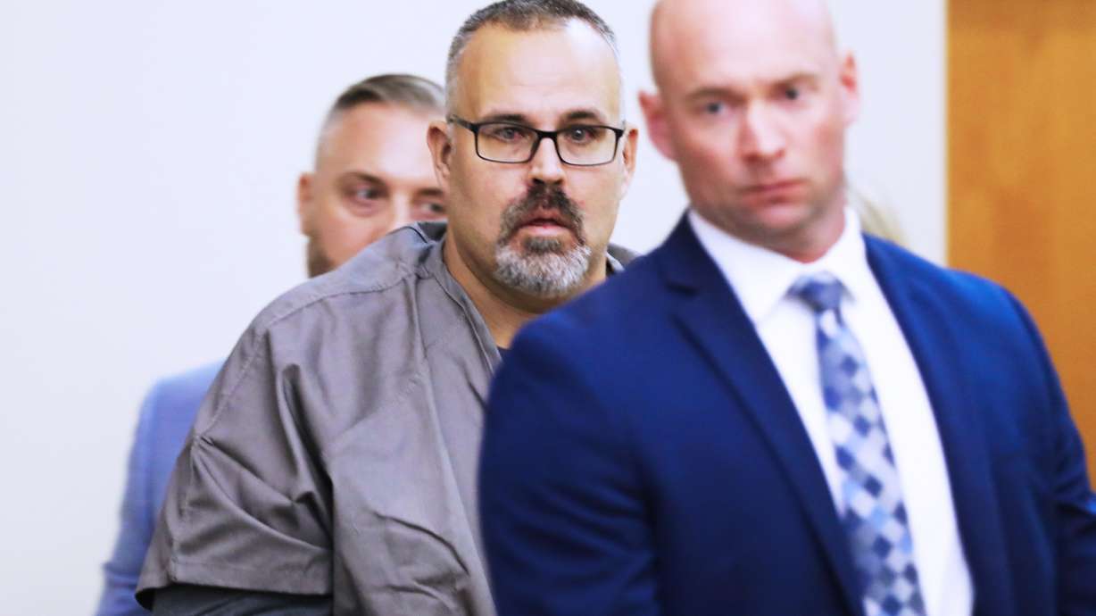 Ex-Letcher County Sheriff Shawn "Mickey" Stines in tears seeing his family as he enters a Letcher County Circuit Court courtroom on Monday, during his arraignment for the fatal shooting of District Judge Kevin Mullins in Whitesburg, Ky.