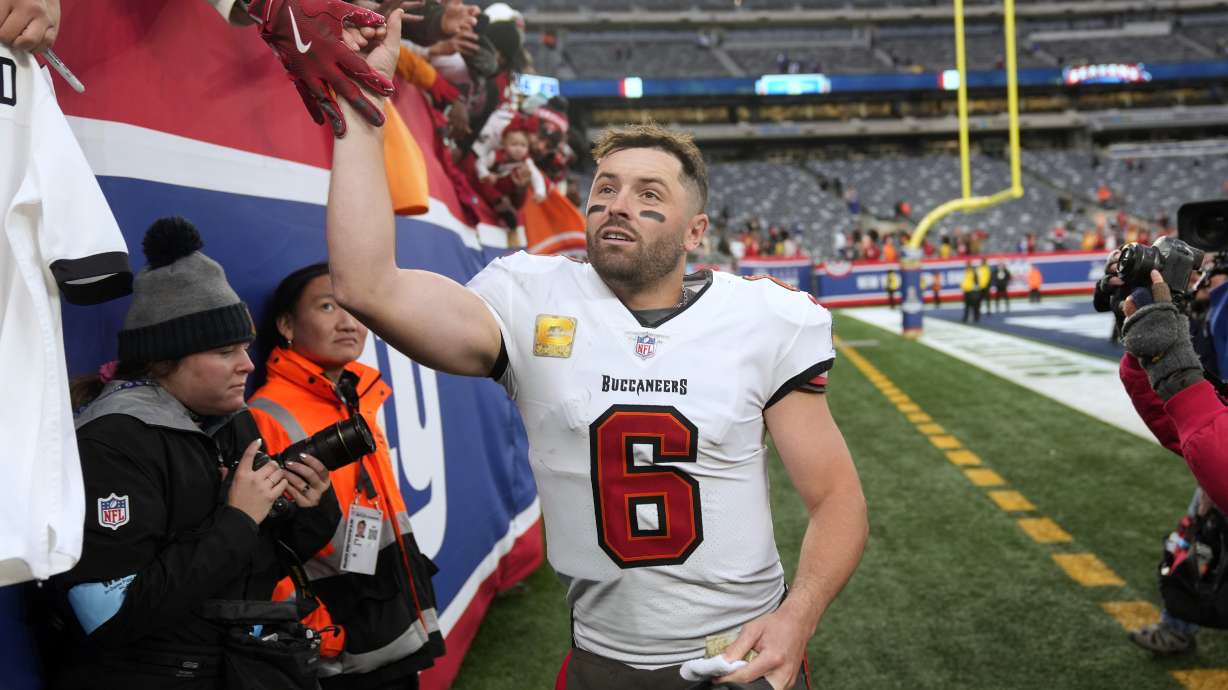 Tampa Bay Buccaneers quarterback Baker Mayfield celebrates with fans after an NFL football game against the New York Giants Sunday, Nov. 24, 2024, in East Rutherford, N.J.