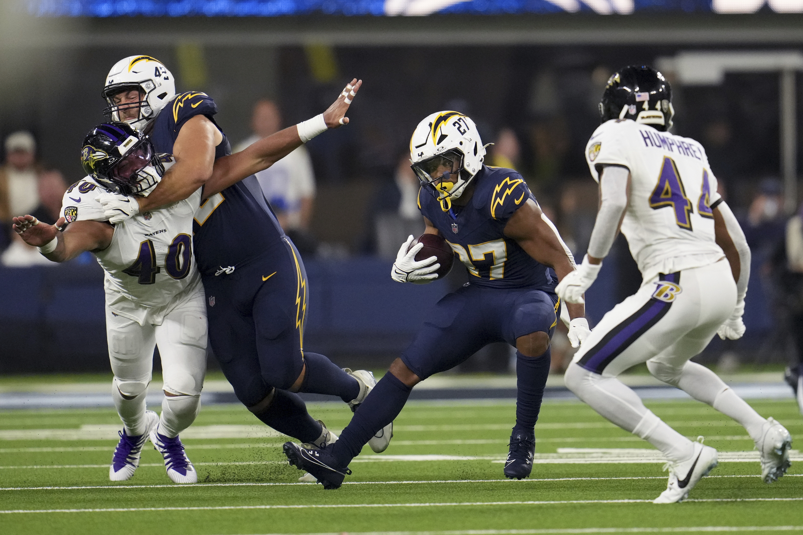Los Angeles Chargers running back J.K. Dobbins (27) carries during the first half of an NFL football game against the Baltimore Ravens, Monday, Nov. 25, 2024, in Inglewood, Calif.