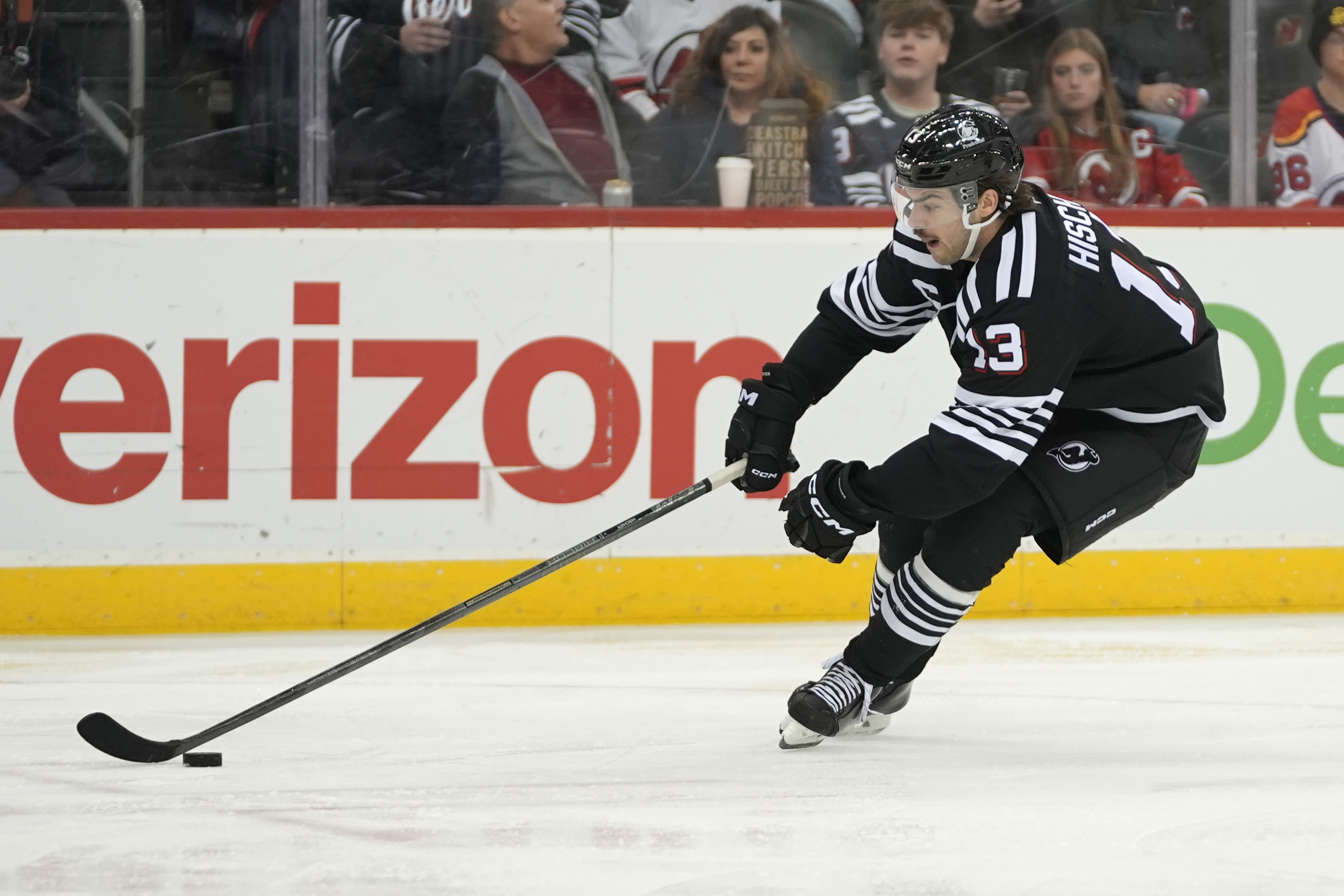 New Jersey Devils' Nico Hischier skates with the puck during the second period of an NHL hockey game against the Nashville Predators, Monday, Nov. 25, 2024, in New York.