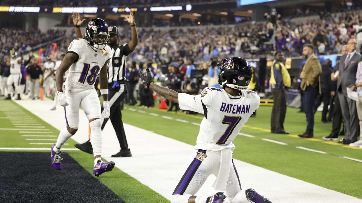 Baltimore Ravens wide receiver Rashod Bateman (7) celebrates his touchdown catch with wide receiver Diontae Johnson (18) during the first half of an NFL football game against the Los Angeles Chargers, Monday, Nov. 25, 2024, in Inglewood, Calif.