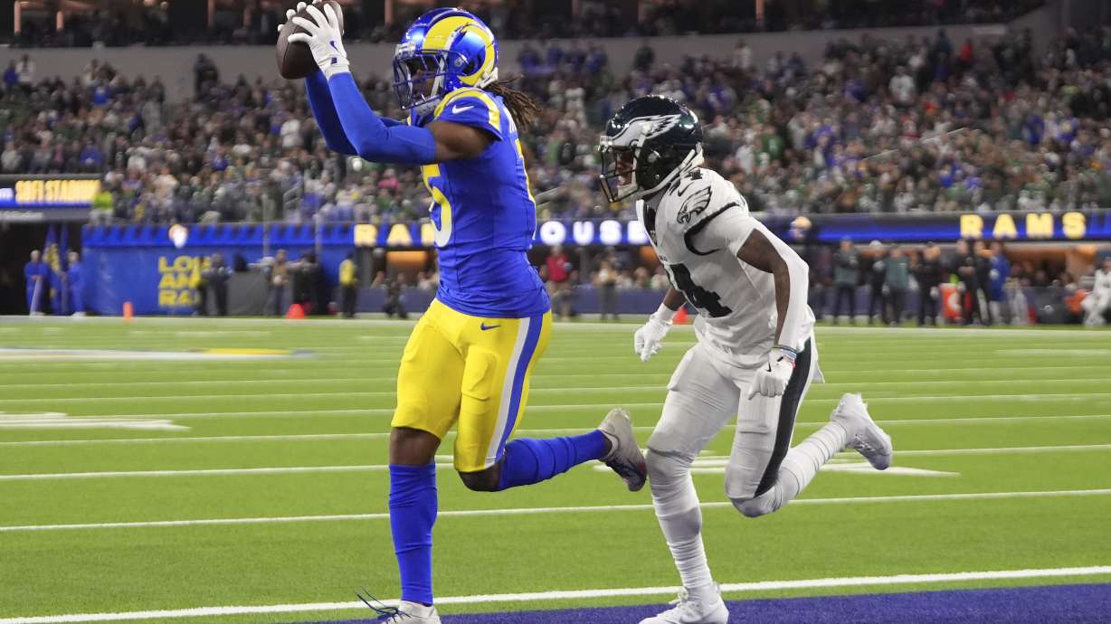 Los Angeles Rams wide receiver Demarcus Robinson, left, catches a touchdown in front of Philadelphia Eagles cornerback Isaiah Rodgers during the second half of an NFL football game in Inglewood, Calif., Sunday, Nov. 24, 2024.