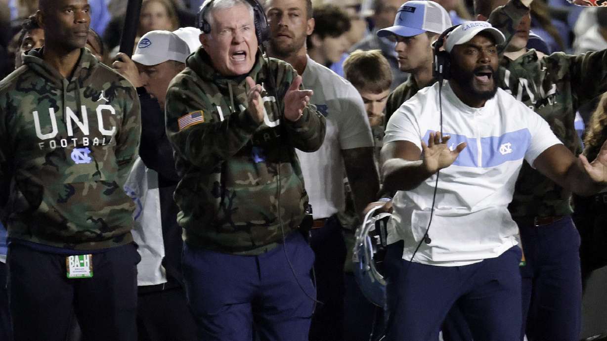 North Carolina head coach Mack Brown, center, reacts to a call during the first half of an NCAA college football game against Wake Forest, Saturday, Nov. 16, 2024, in Chapel Hill, N.C.