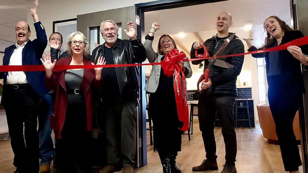 Civic leaders gather for the ribbon-cutting event celebrating the Asteri housing complex, Cedar City, Oct. 29.