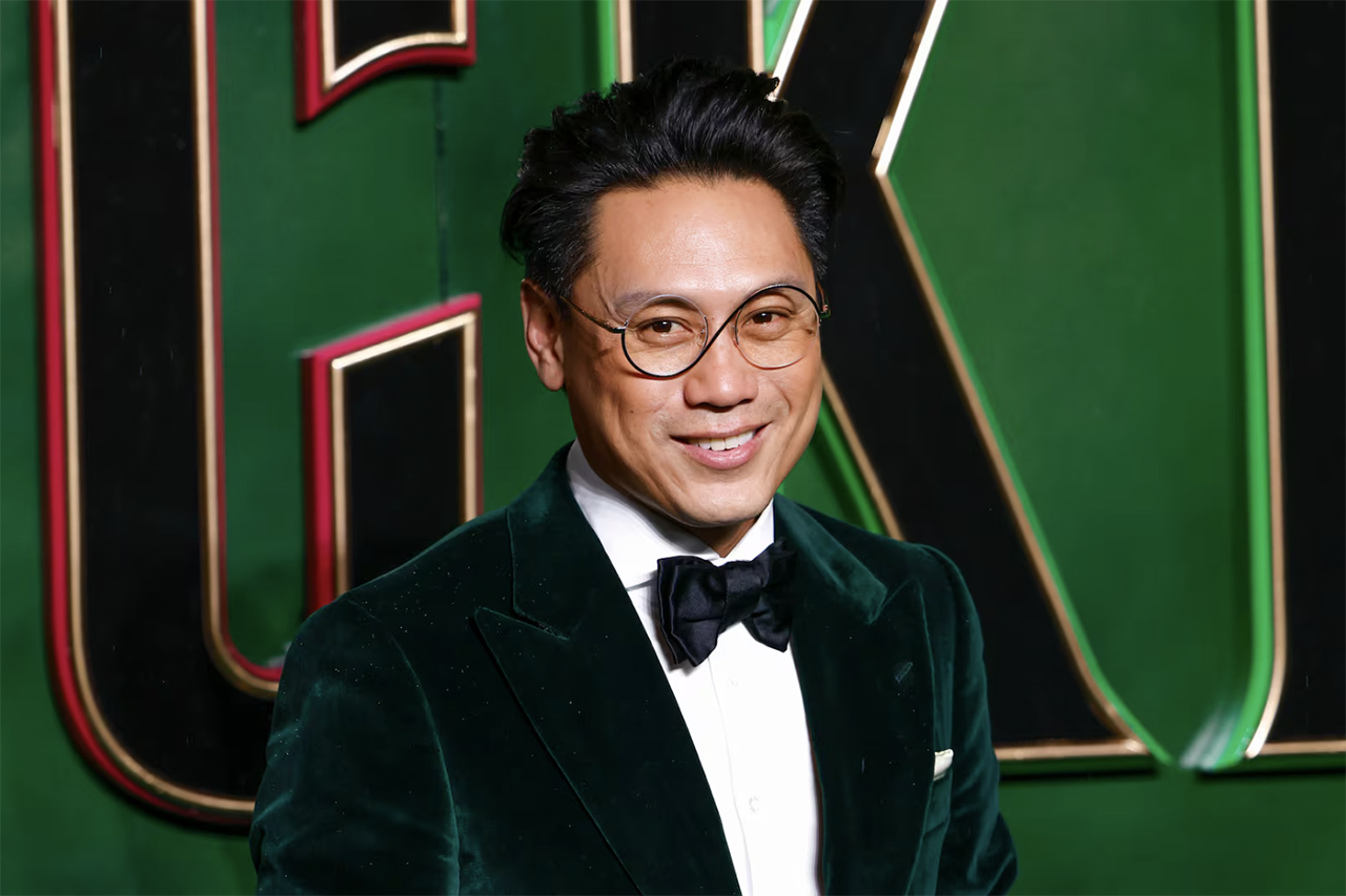 Director Jon M. Chu poses for photographers upon arrival at the premiere of the film "Wicked" on Nov. 18, in London.