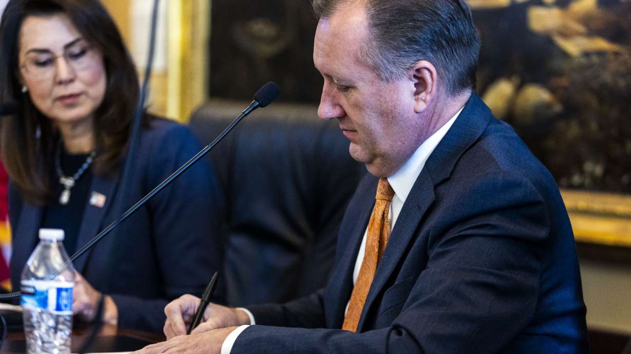 Utah State Auditor John Dougall certifies election results during a State Board of Canvassers meeting at the state Capitol in Salt Lake City on Monday.