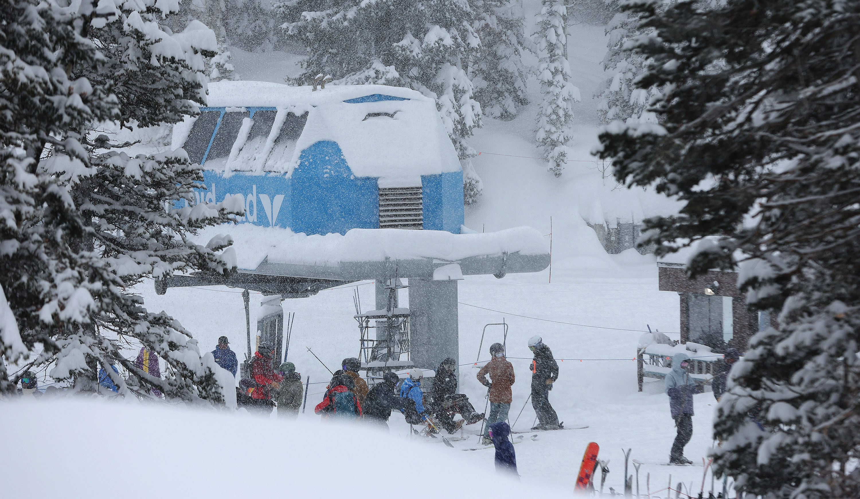 Skiers board the lift in newly fallen snow at Snowbird Ski Resort on Feb. 7.