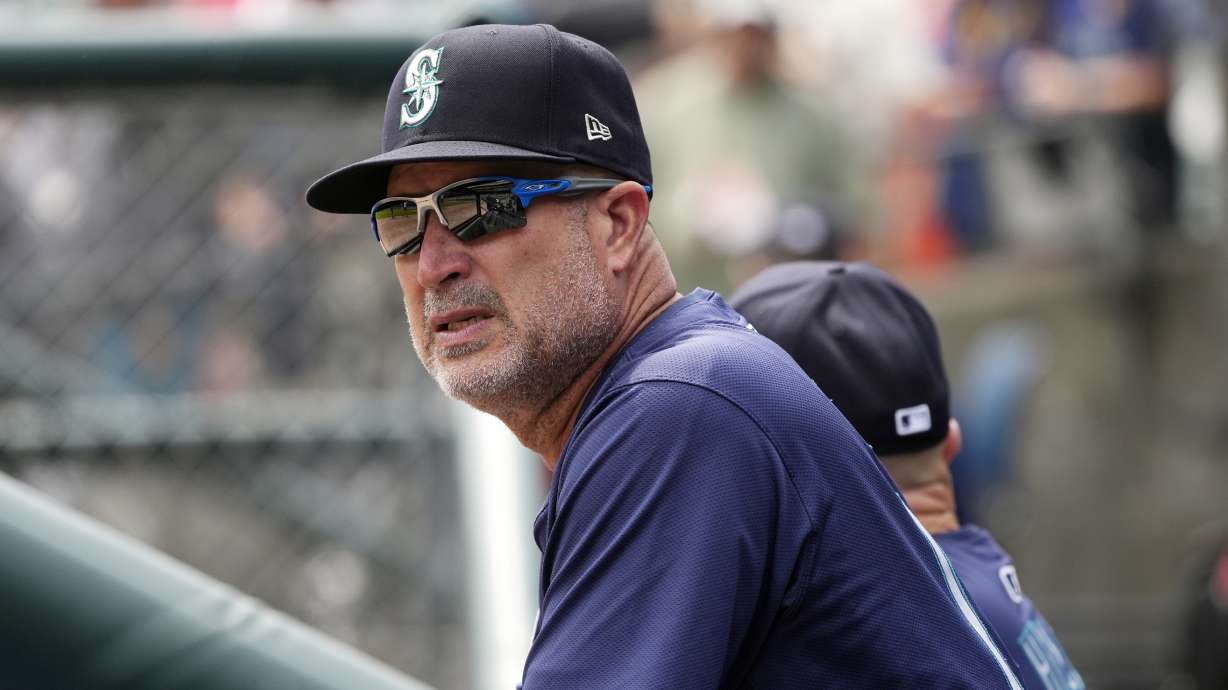 FILE - Seattle Mariners third base coach Manny Acta watches from the dugout during the first inning of a baseball game against the Detroit Tigers, Thursday, Aug. 15, 2024, in Detroit.