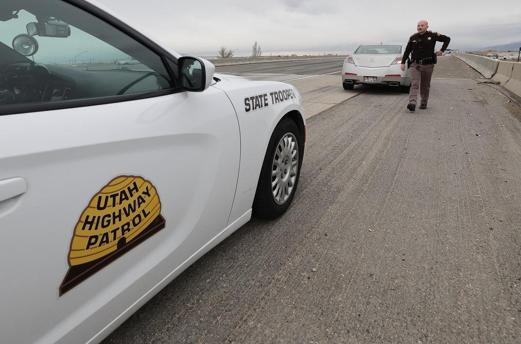 Utah Highway Patrol trooper Brian Schlicher pulls over a driver for a seat belt violation in Salt Lake County on Tuesday. Utah Department of Public Safety and 42 police agencies statewide will increase seat belt enforcement throughout Utah from Wednesday through Sunday, working more than 260 additional shifts around the holiday travel period to educate motorists who aren’t wearing seat belts.