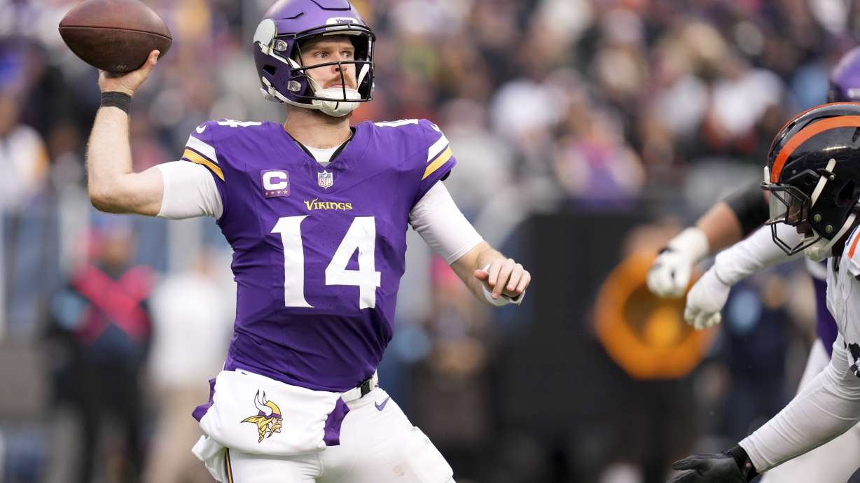 Minnesota Vikings quarterback Sam Darnold (14) throws a pass during the second half of an NFL football game against the Chicago Bears, Sunday, Nov. 24, 2024, in Chicago.