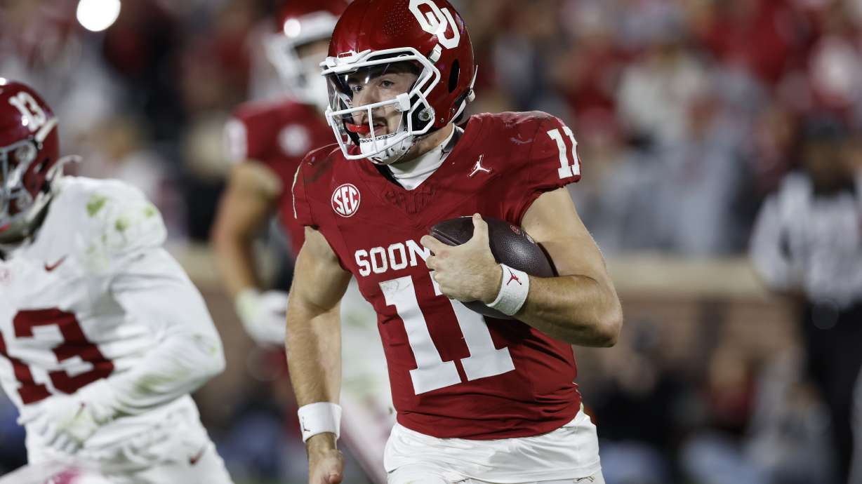 Oklahoma quarterback Jackson Arnold (11) runs the ball against Alabama during the second half of a NCAA college football game Saturday, Nov. 23, 2024, in Norman, Okla.