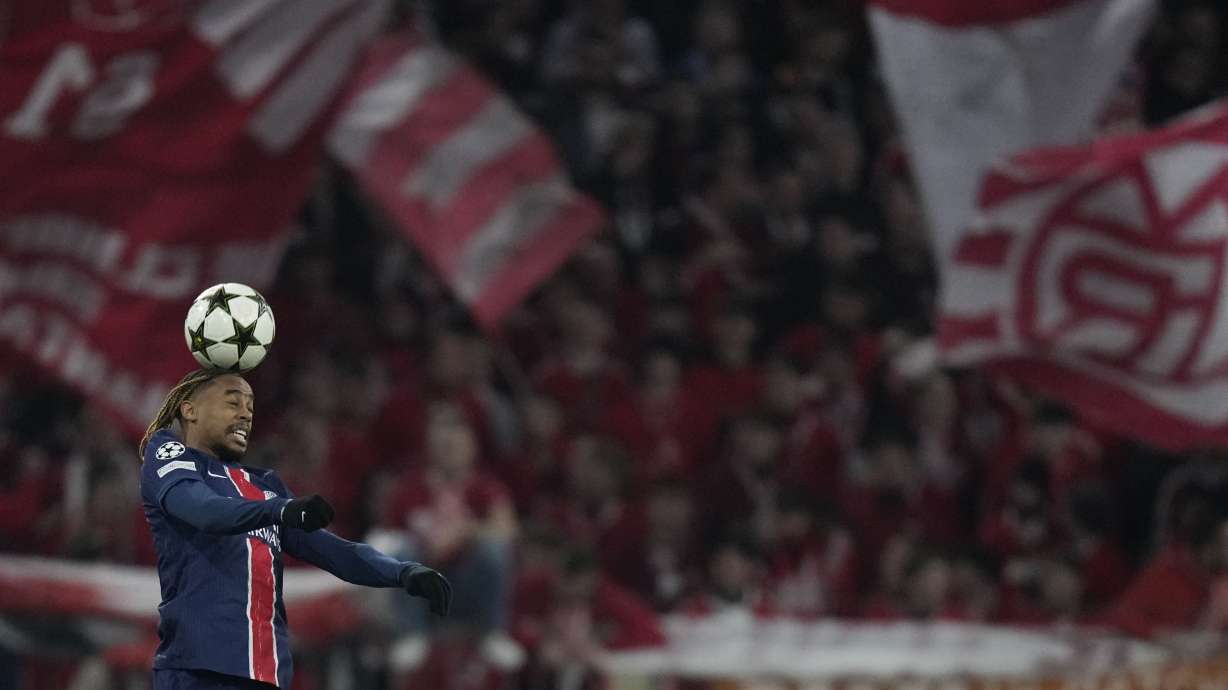 PSG's Bradley Barcola heads the ball during the Champions League opening phase soccer match between FC Bayern and Paris Saint Germain, at the Allianz Arena in Munich, Germany, Tuesday, Nov. 26, 2024.