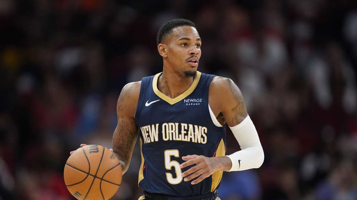 FILE - New Orleans Pelicans guard Dejounte Murray dribbles against the Houston Rockets during the second half of an NBA preseason basketball game, Oct. 15, 2024, in Houston.