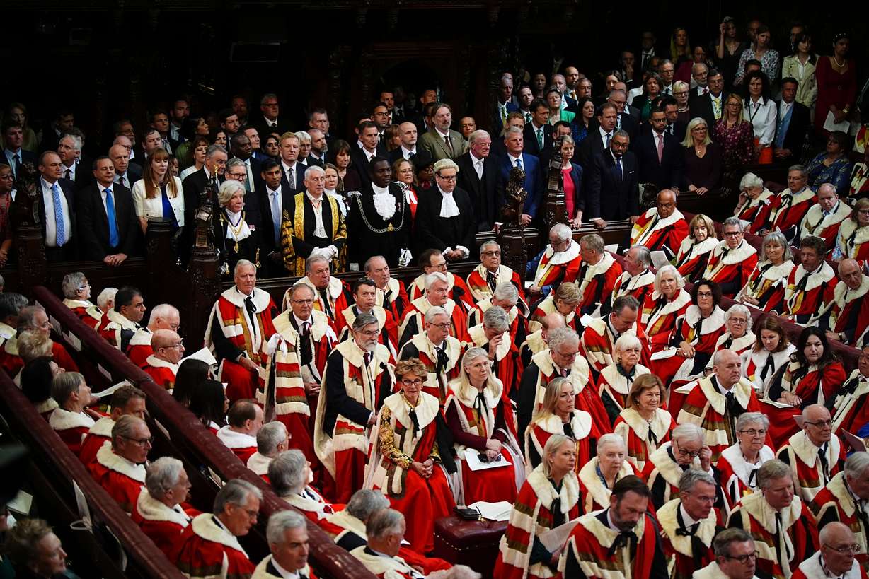 Members of the House of Commons listen to the King's Speech during the State Opening of Parliament in the chamber of the House of Lords at the Palace of Westminster, London, July 17.