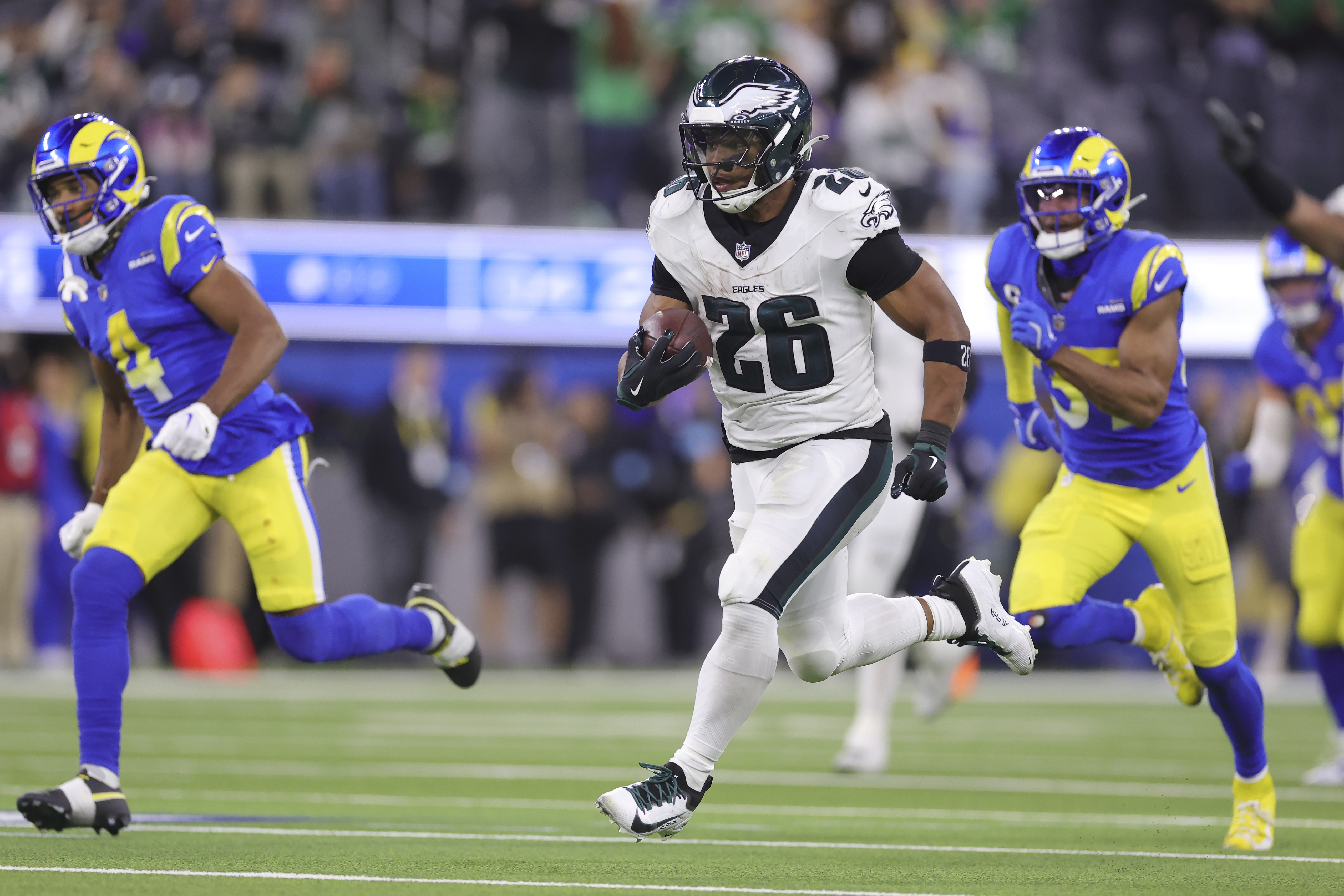 Philadelphia Eagles running back Saquon Barkley (26) runs for a touchdown against the Los Angeles Rams during the second half of an NFL football game in Inglewood, Calif., Sunday, Nov. 24, 2024.