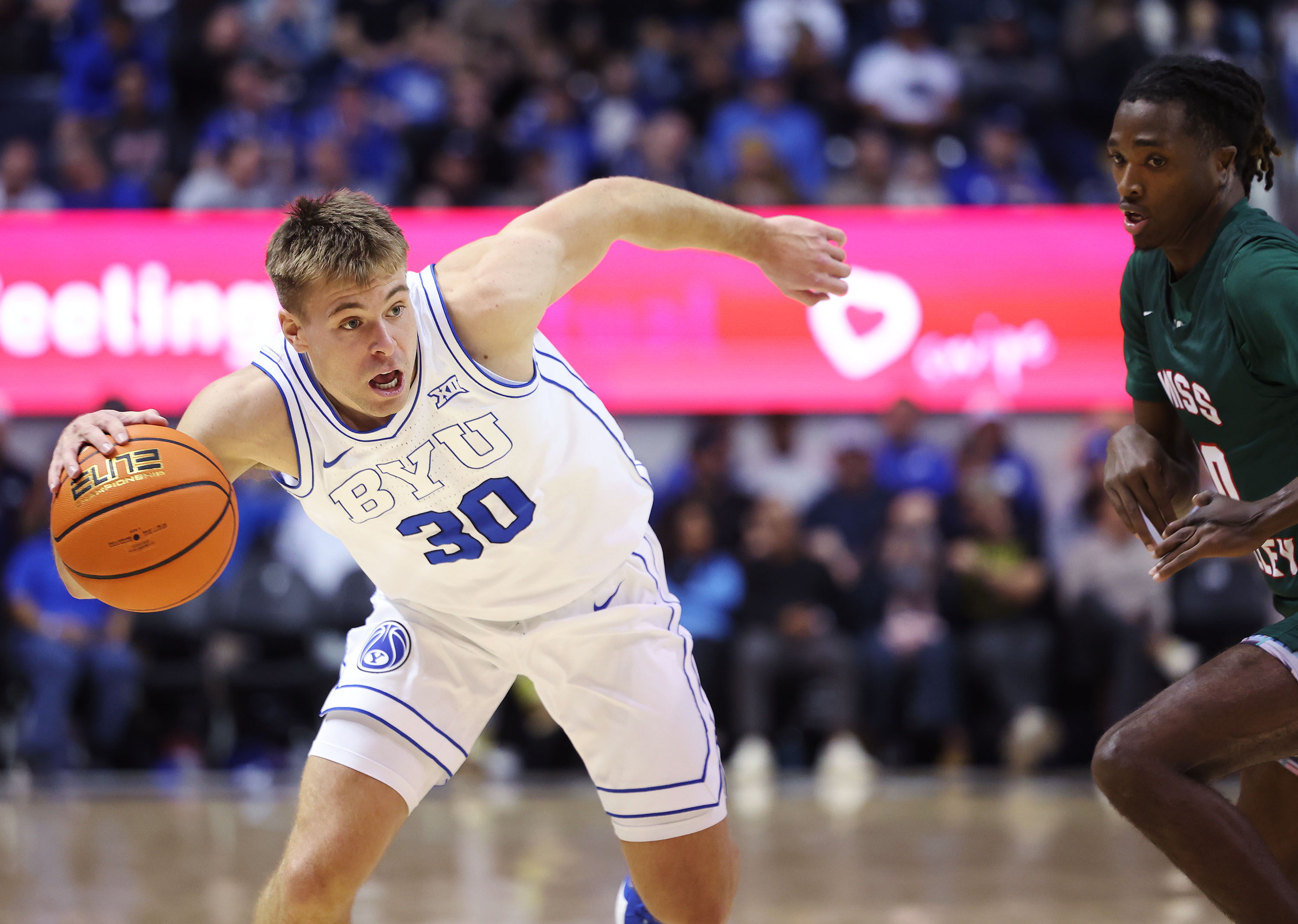 Brigham Young guard Dallin Hall (30) drives on Mississippi Valley State guard Arthur Tate (0) in Provo on Saturday, Nov. 23, 2024. BYU won 87-43.