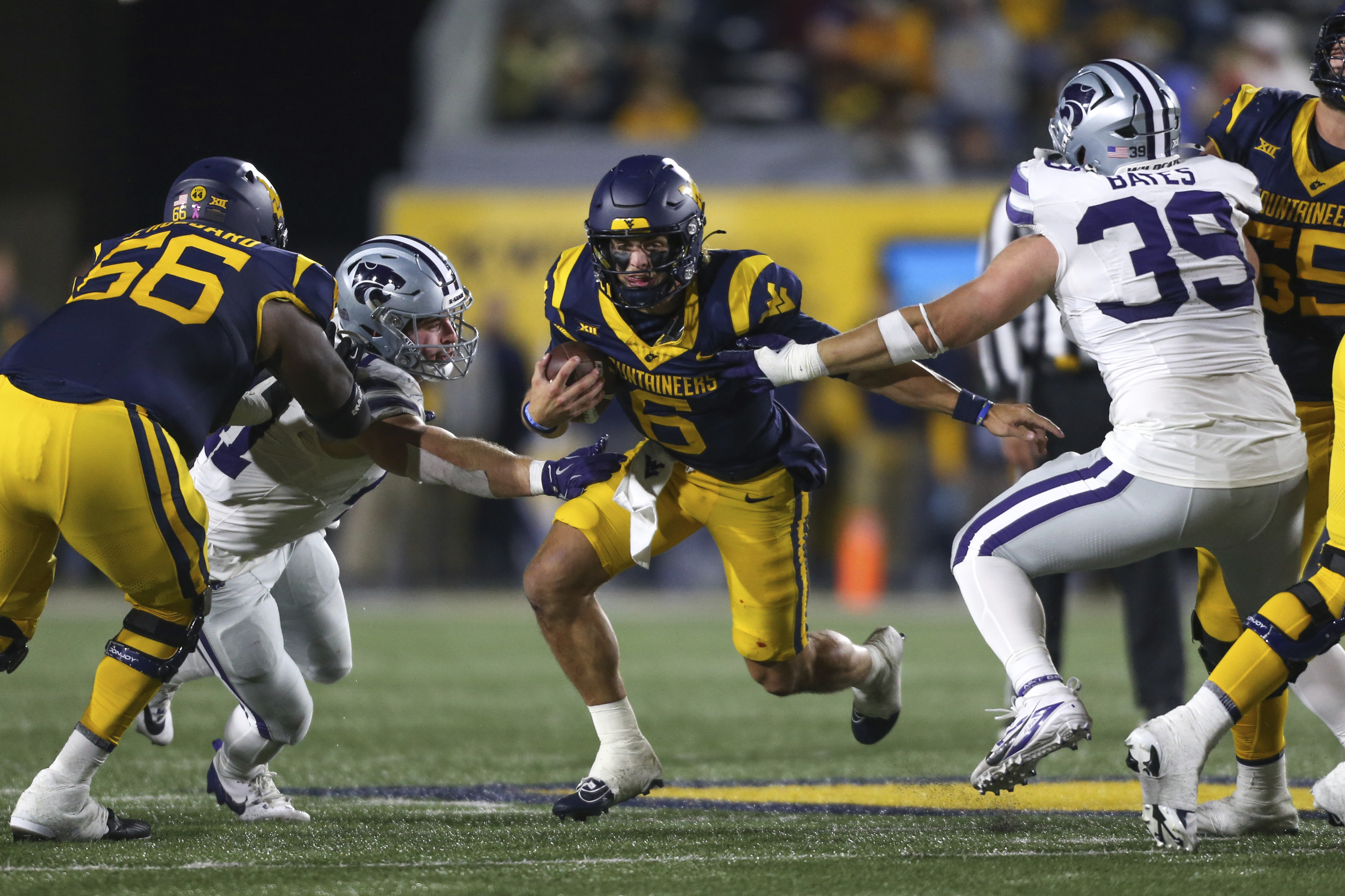 FILE - West Virginia quarterback Garrett Greene (6) rushes the ball against Kansas State during the frist half of an NCAA college football game, Saturday, Oct. 19, 2024, in Morgantown, W.Va. 