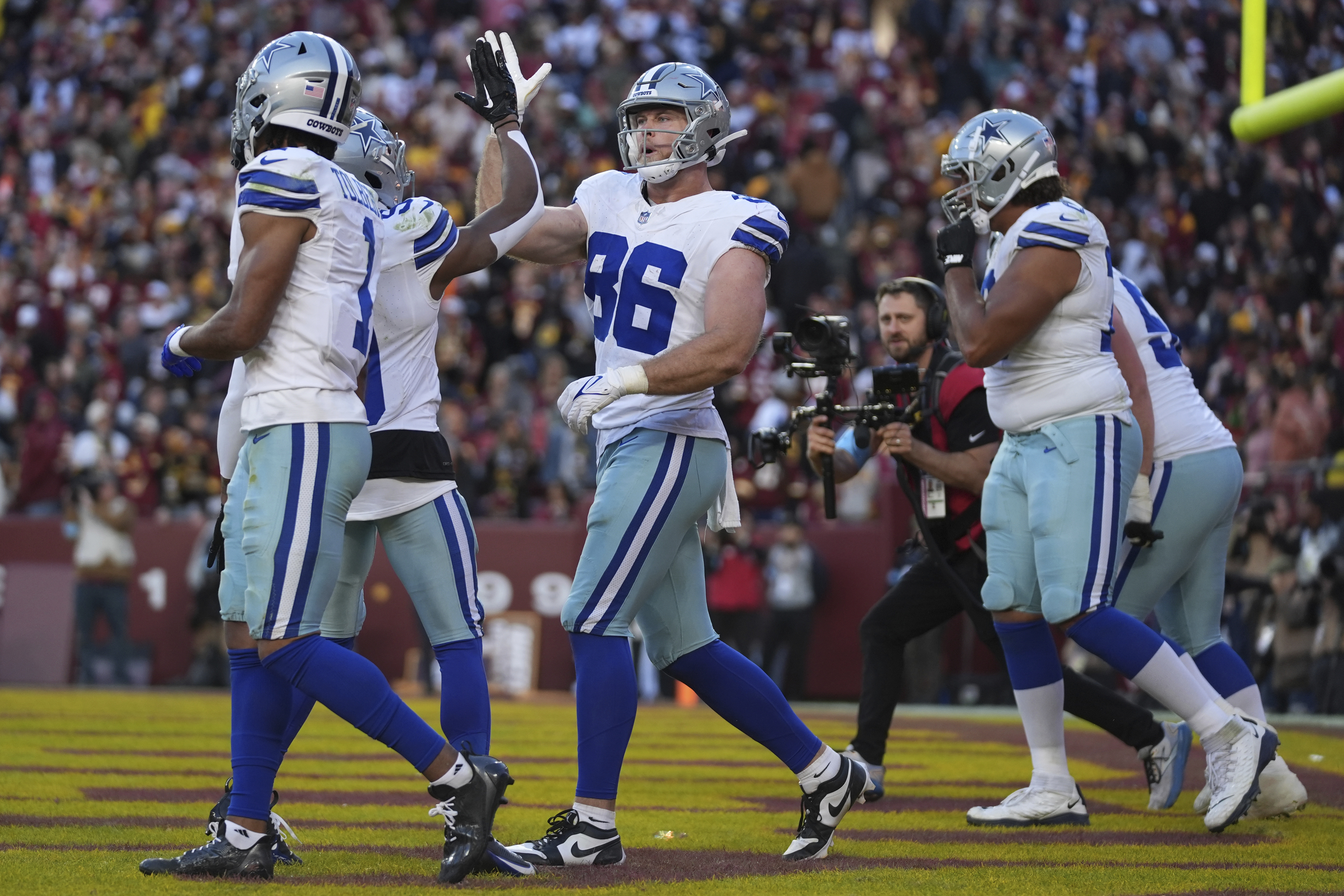 Dallas Cowboys tight end Luke Schoonmaker (86) celebrates after scoring a 22-yard touchdown during the second half of an NFL football game against the Washington Commanders, Sunday, Nov. 24, 2024, in Landover, Md. 