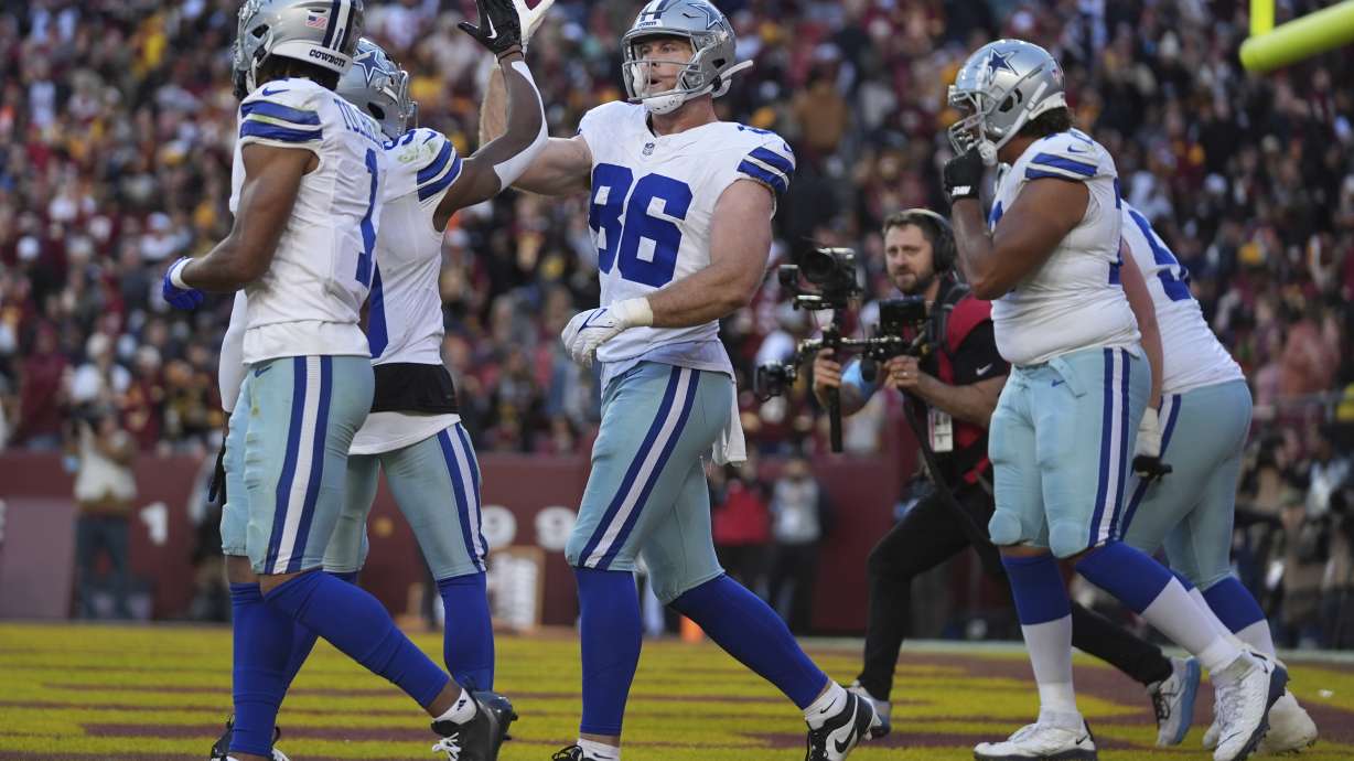 Dallas Cowboys tight end Luke Schoonmaker (86) celebrates after scoring a 22-yard touchdown during the second half of an NFL football game against the Washington Commanders, Sunday, Nov. 24, 2024, in Landover, Md.