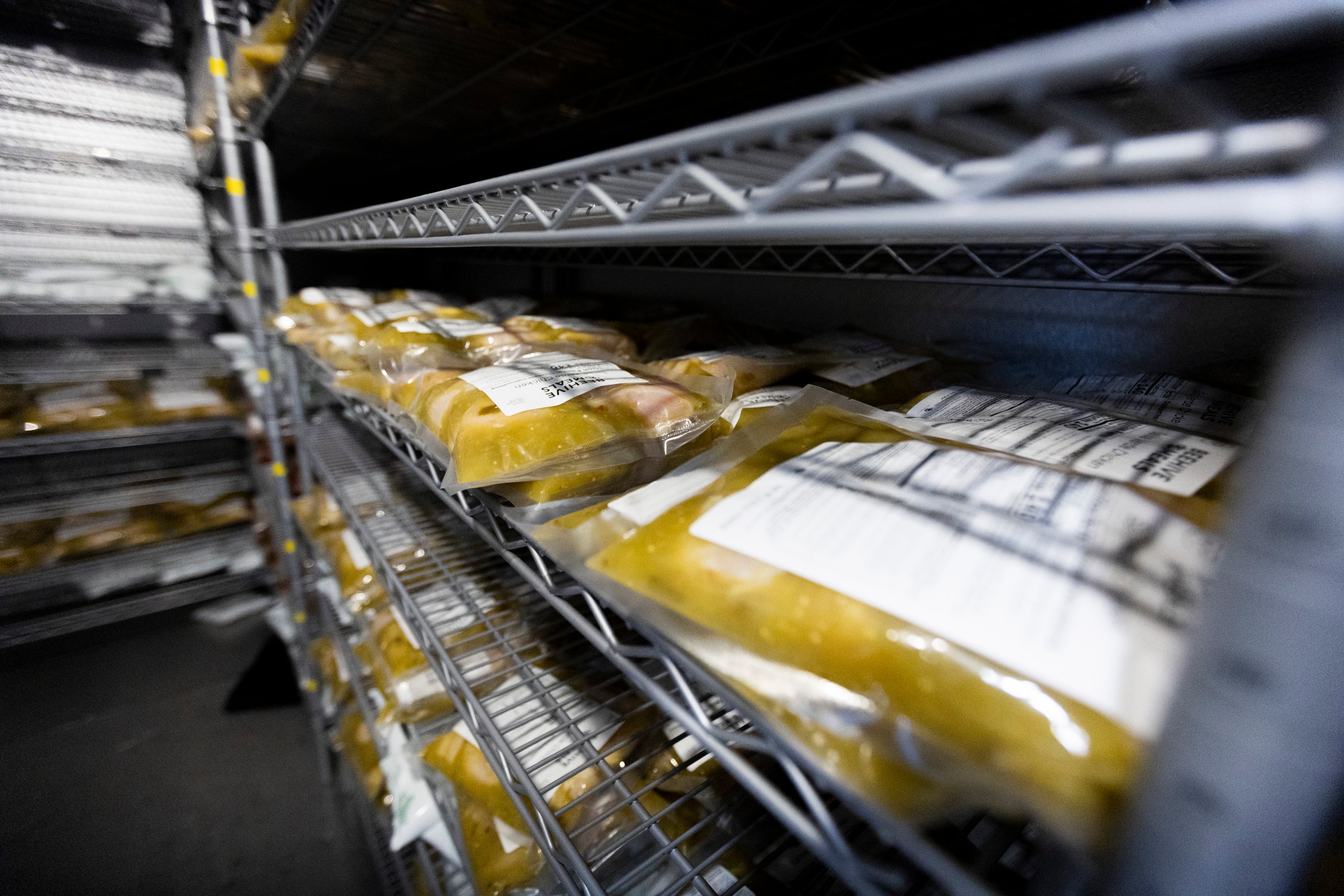 A freezer full of packaged meals at Beehive Meals warehouse in Layton on Oct. 21.