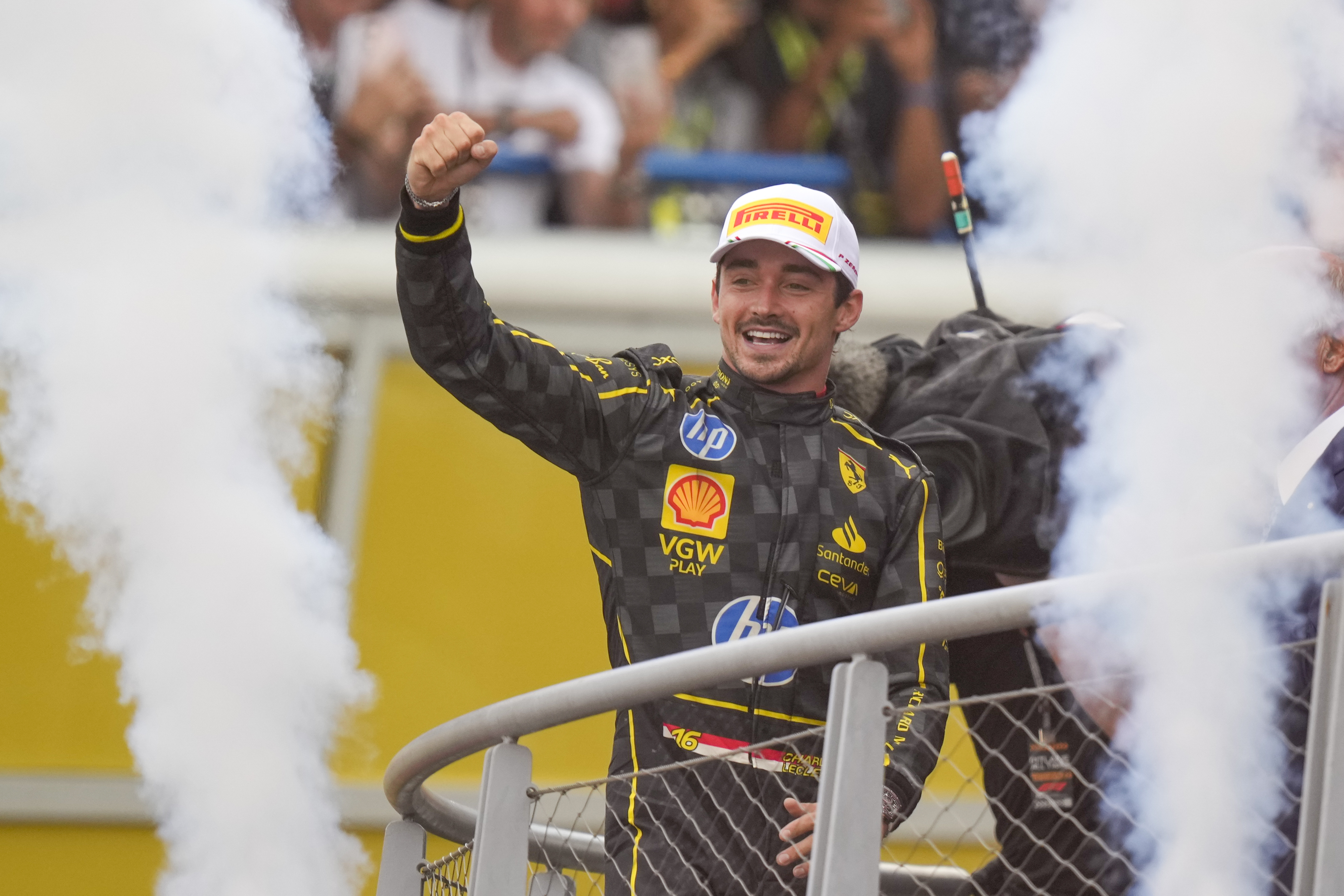FILE - Ferrari driver Charles Leclerc of Monaco celebrates on the podium after the Formula One Italian Grand Prix race at the Monza racetrack, in Monza, Italy, Sept. 1, 2024.