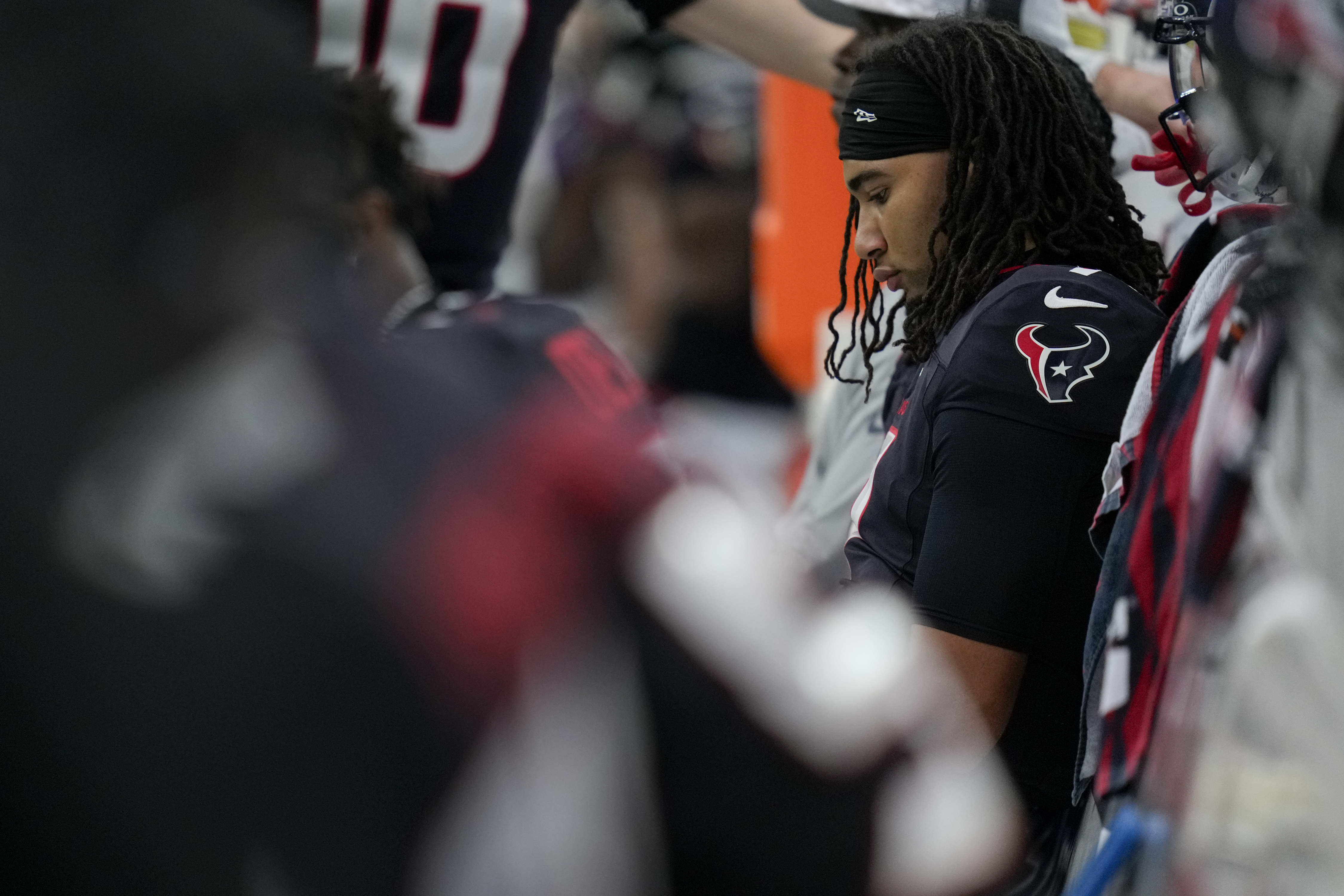 Houston Texans quarterback C.J. Stroud sits on the bench late in the second half an NFL football game against the Tennessee Titans, Sunday, Nov. 24, 2024, in Houston. 